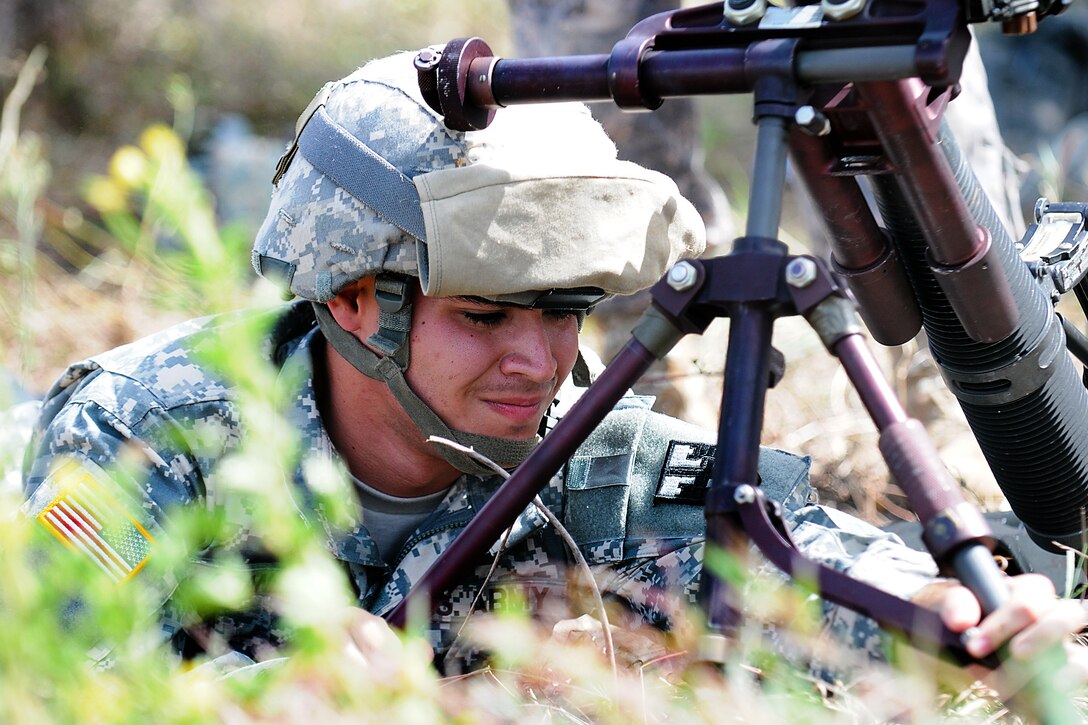 Army Pfc. Edward Granela adjusts the tripod of his 60mm mortar during a field exercise
at Camp Santiago Joint Maneuver Training Center in Salinas, Puerto Rico, July 11, 2012. Granela is assigned to the Puerto Rico National Guard 296th Infantry Battalion, 101st Troop Command.