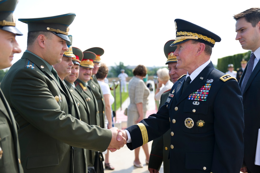 Visiting Russian Army Gen. Nikolay Y. Makarov, chief of the Russian general staff and first deputy defense minister general, introduces members of his staff to U.S. Army Gen. Martin E. Dempsey, chairman of the Joint Chiefs of Staff, following a full honor cordon at the Pentagon, July 12, 2012. 