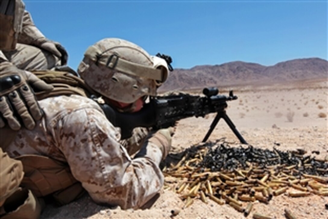 A Marine fires his M240G machine gun during a live-fire weapons training exercise as part of Javelin Thrust 2012 on Marine Corps Air Ground Combat Center Twentynine Palms, Calif., July 9, 2012. The Marine is assigned to the 1st Marine Expeditionary Brigade, Law Enforcement Battalion. Javelin Thrust is an annual exercise that allows active and reserve Marines and sailors from 38 different states to train together. 