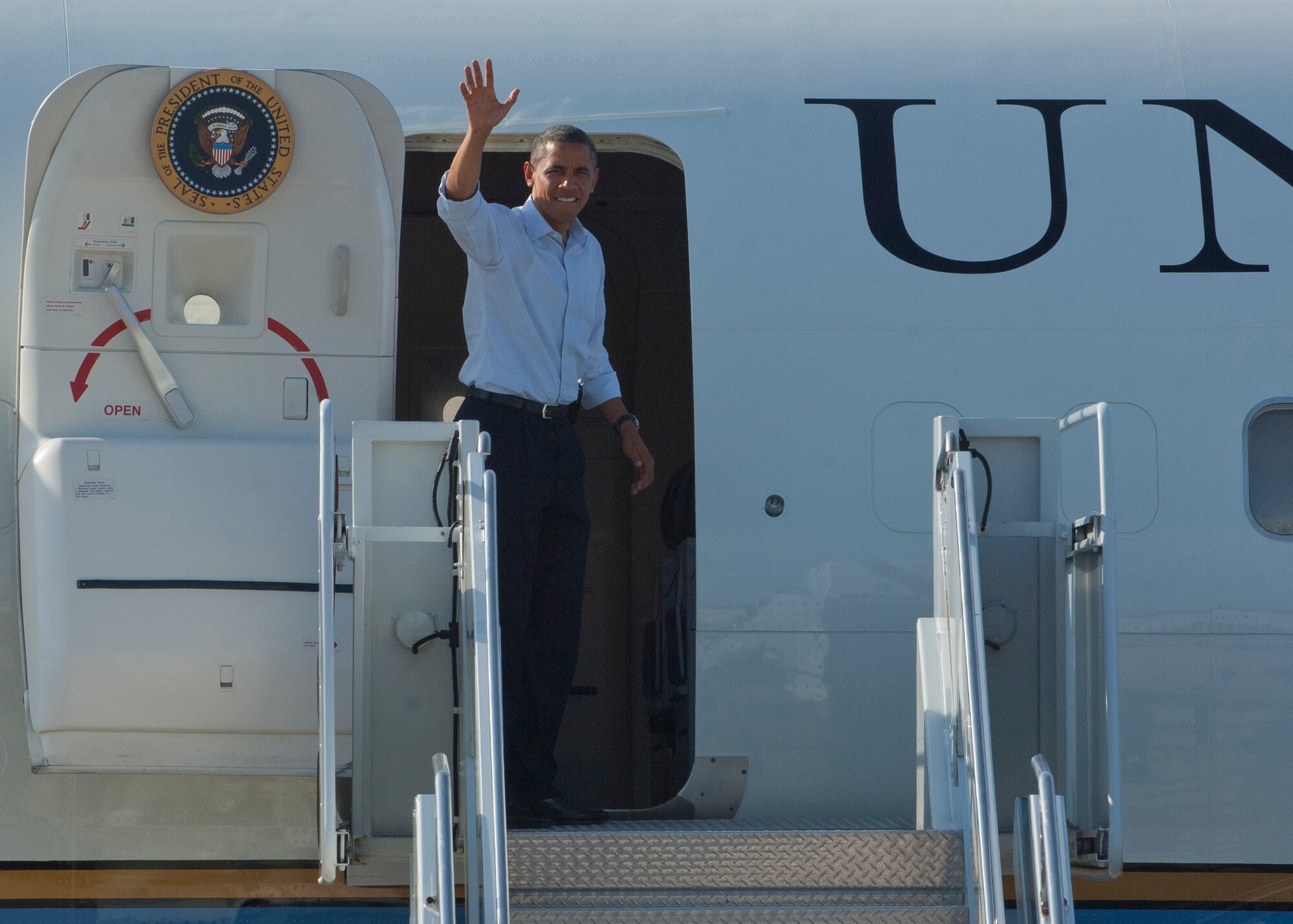 President Barack Obama boards Air Force One at Langley Air Force Base, Va., July 13, 2012.  The president flew in to Langley to conduct part of a weekend-long campaign tour in Virginia. (U.S. Air Force photo by Senior Airman John Strong II/Released)