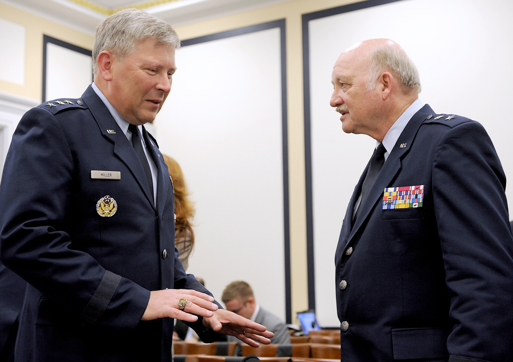 Lt. Gen. Christopher Miller, Deputy Chief of Staff for Strategic Plans and Programs, Headquarters, U.S. Air Force, speaks with Maj. Gen. Timothy Lowenberg, the Adjutant General, Washington, and commander of all Washington Army and Air National Guard forces, prior to a hearing before the House Armed Services Committee on Air Force aircraft force structure reductions, in Washington, D.C., July 12, 2012,   (U.S. Air Force photo/Senior Airman Christina Brownlow)