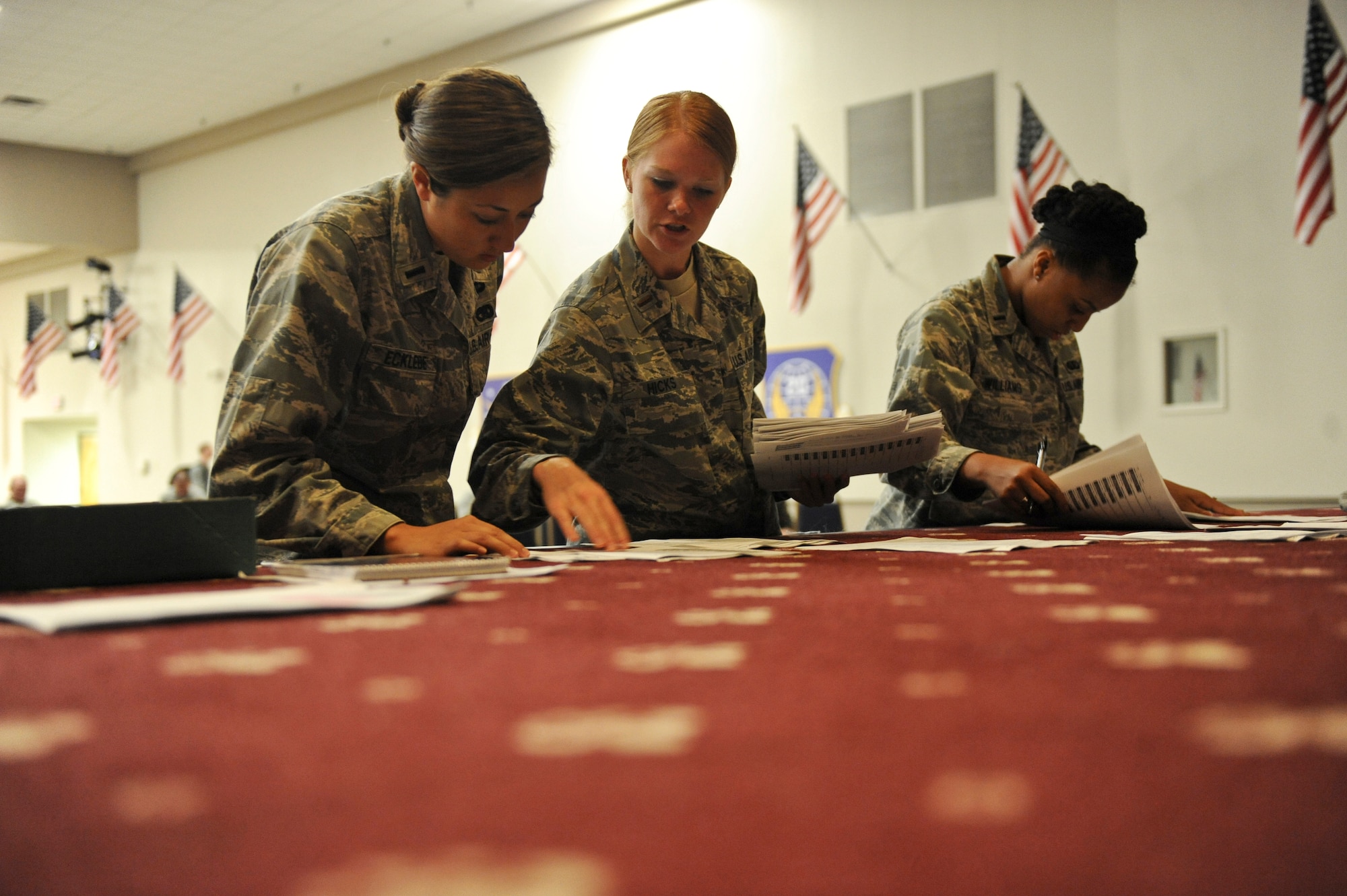 Lieutenants from the 2nd Force Support Squadron and 2nd Logistics Readiness Squadron go through temporary duty orders in Hoban Hall on Barksdale Air Force Base, La., July 12. Members of the 2 FSS and 2 LRS arranged the movement of more than 43 tons of cargo along with 157 Airmen to Nellis AFB, Nev., for Red Flag. Red Flag is an exercise that provides realistic combat scenarios for aircrews from the U.S., NATO and allied countries. (U.S. Air Force photo/Airman 1st Class Micaiah Anthony)(RELEASED)