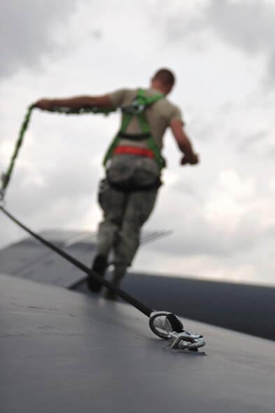 Staff Sgt. Joseph Caughron, 2nd Aircraft Maintenance Squadron aircraft pneudraulics technician, walks along the wing of a B-52H Stratofortress on Barksdale Air Force Base, La., July 11. Maintenance Airmen worked around-the-clock to ensure all aircraft participating in the Red Flag exercise at Nellis AFB, Nev., were ready for departure. The exercise provides realistic combat scenarios for aircrews from the U.S., NATO and allied countries. (U.S. Air Force photo/Airman 1st Class Micaiah Anthony)(RELEASED)