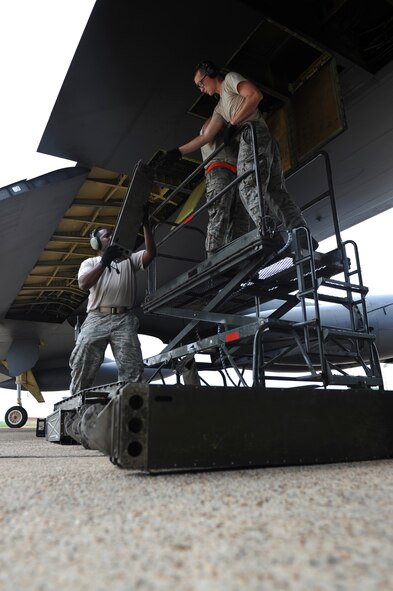 Electronic warfare Airmen from the 2nd Aircraft Maintenance Squadron unload chaff from a B-52H Stratofortress on Barksdale Air Force Base, La., July 11. Only B-52Hs not participating in the Red Flag exercise at Nellis AFB, Nev., had their chaff removed. Airmen loaded the remaining chaff onto B-52s departing for the exercise to save the Air Force money. Chaff is used as a defensive measure to conceal the aircraft from enemy radar by dispensing small, thin pieces of metal. (U.S. Air Force photo/Airman 1st Class Micaiah Anthony)(RELEASED)