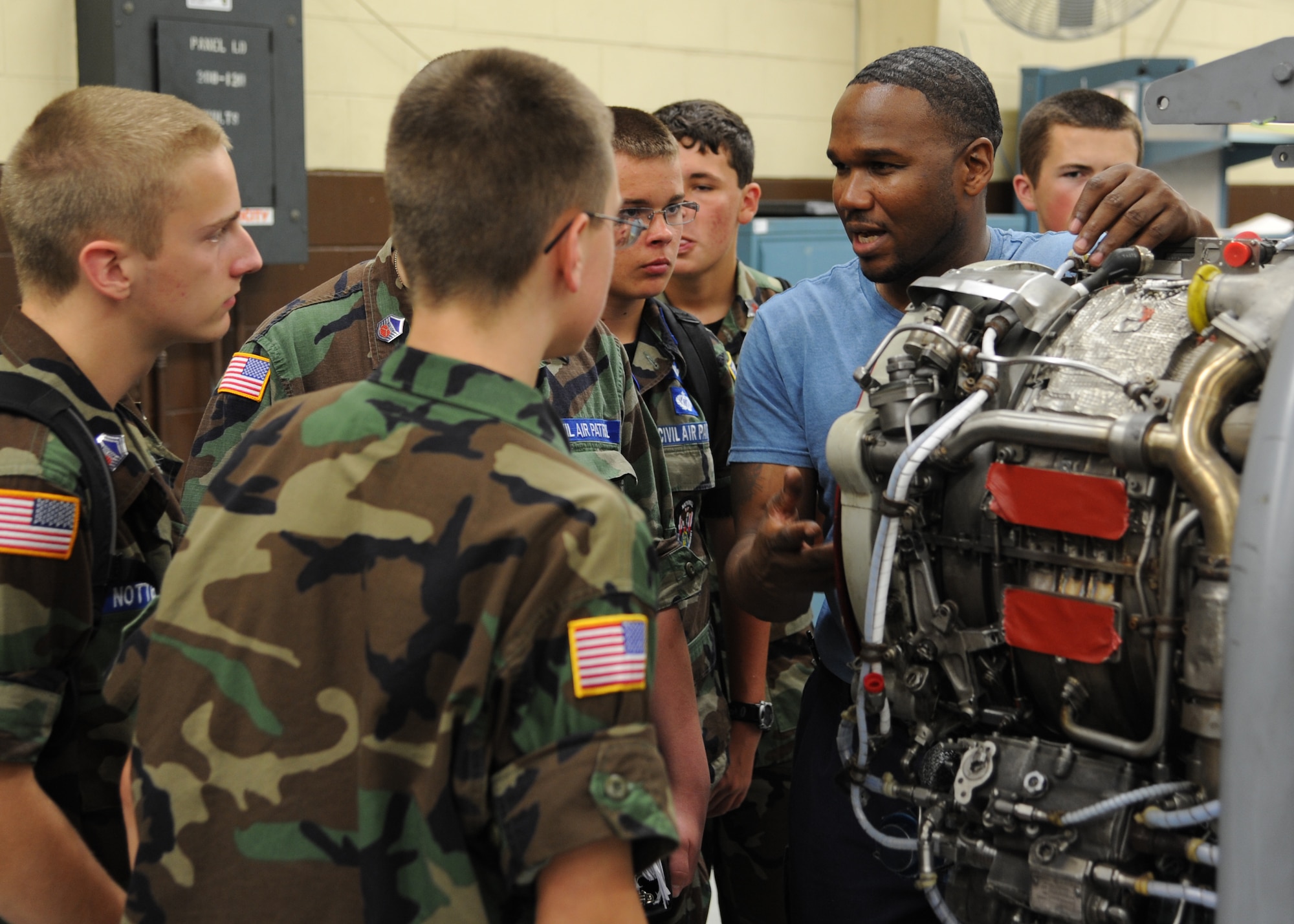 Civil Air Patrol cadets listen close as Rodney Williams, Dyncorp Senior Mechanic explains the past of a J-85 engine on July 11 at the engine shop. The cadets spent July 6-14 learning about the many aspects of Specialized Undergraduate Pilot Training. (U.S. Air Force photo/Senior Airman Chase Hedrick) 