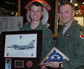 Honorary ‘Pilot for a Day’ Collin Rowley (left) spent some time with the 388th Fighter Wing July 12 at Hill Air Force Base, Utah. U.S. Air Force Capt. John Loveman, an F-16 pilot with the 421st Fighter Squadron, escorted Rowley and his family to the simulator, air traffic tower and static aircraft display. Rowley was diagnosed with Metastatic Medulloblastoma, a fatal brain tumor. (U.S. Air Force photo by Alex Lloyd/Released).