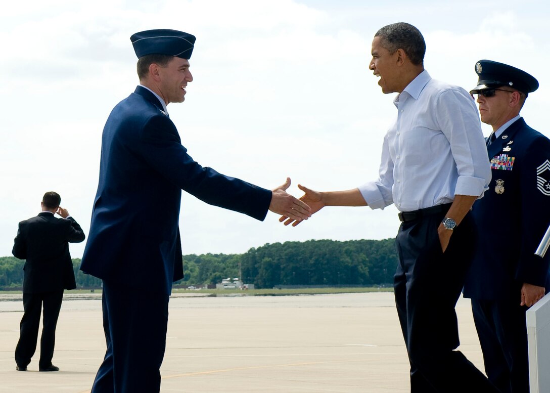 U.S. Air Force Col. Korvin Auch, 633rd Air Base Wing commander, greets President Barack Obama upon his arrival at Langley Air Force Base, Va., July 13, 2012. The president's two-day campaign swing through Virginia includes stops in Virginia Beach, Hampton, Roanoke and the Richmond area. (U.S. Air Force photo by Senior Airman John Strong II/Released)