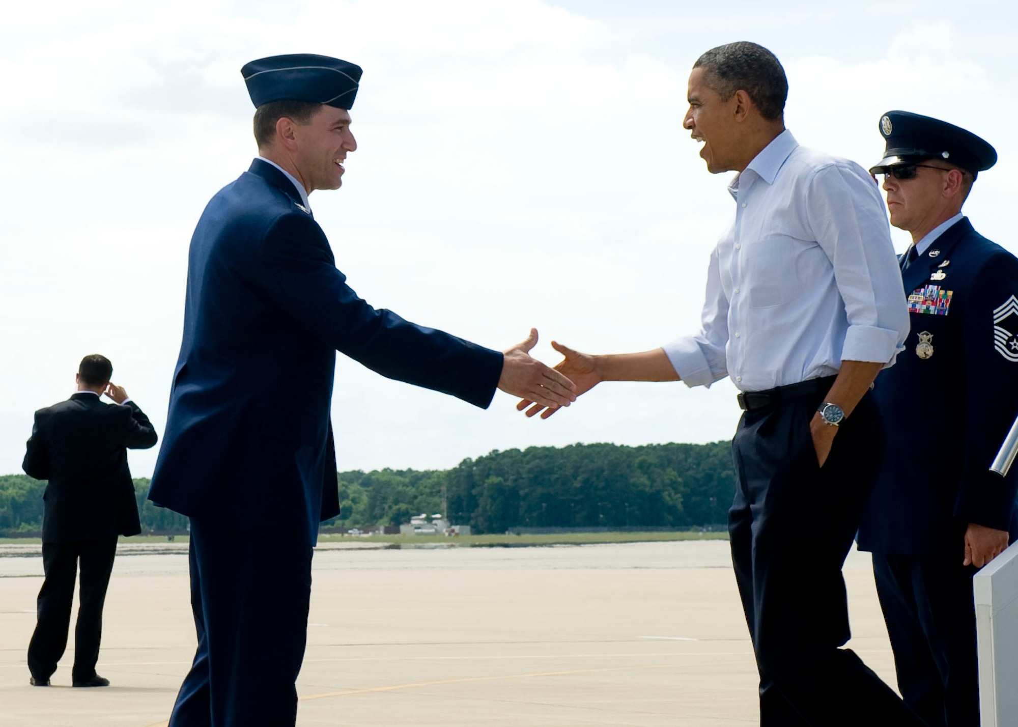 U.S. Air Force Col. Korvin Auch, 633rd Air Base Wing commander, greets President Barack Obama upon his arrival at Langley Air Force Base, Va., July 13, 2012. The president's two-day campaign swing through Virginia includes stops in Virginia Beach, Hampton, Roanoke and the Richmond area. (U.S. Air Force photo by Senior Airman John Strong II/Released)