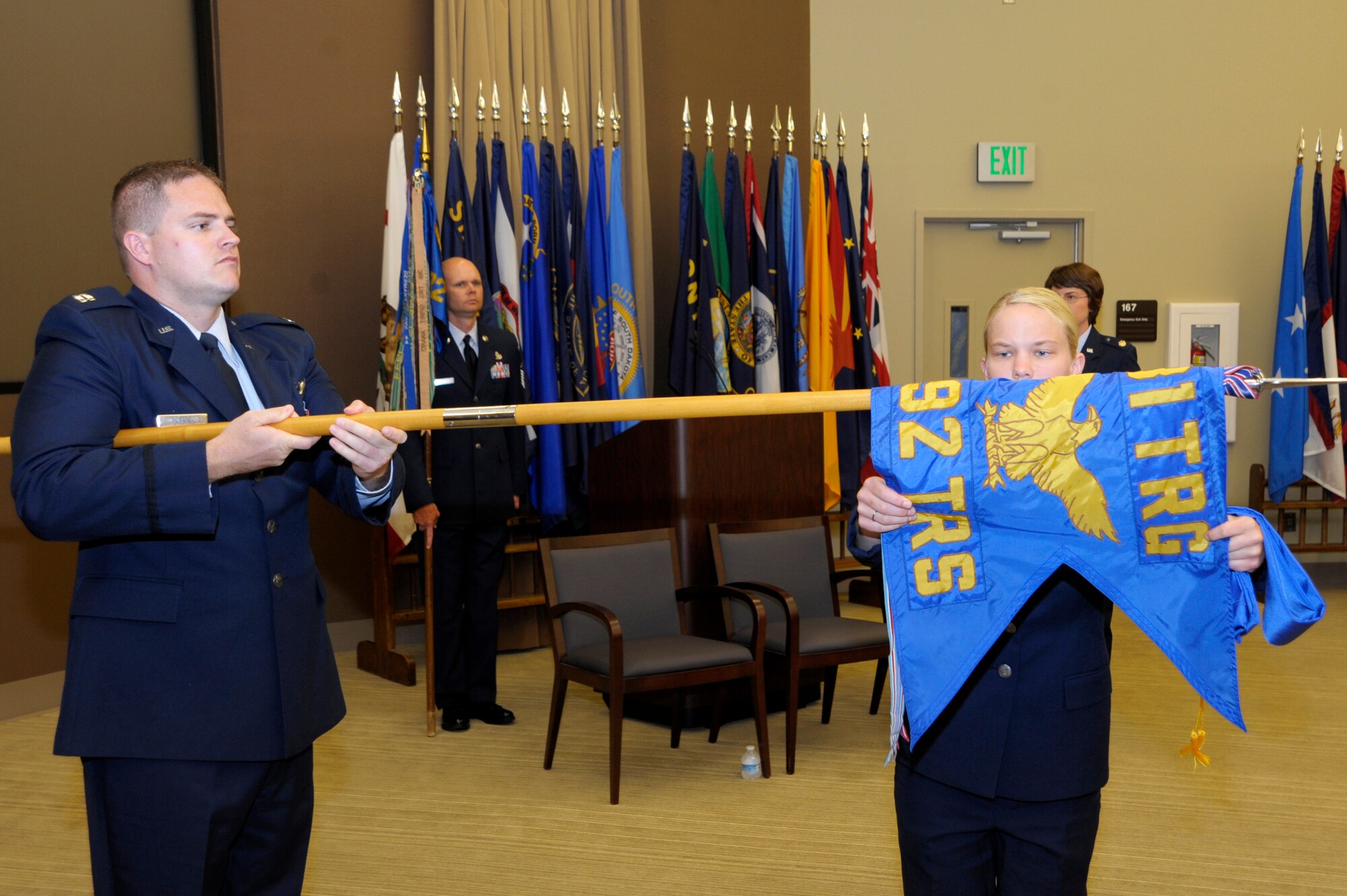 Airmen from the 381st Training Group retire the 392nd Training Squadron's flag during the 392nd deactivation ceremony here July 2. The 392nd TRS, The Air Force’s only Air Force Specialty Code-awarding Intercontinental Ballistic Missile operations qualification squadron deactivated July 2 here and merged with the 532nd Training Squadron, a missile maintainer training squadron. (U.S. Air Force photo/Jerry E. Clemens Jr.)