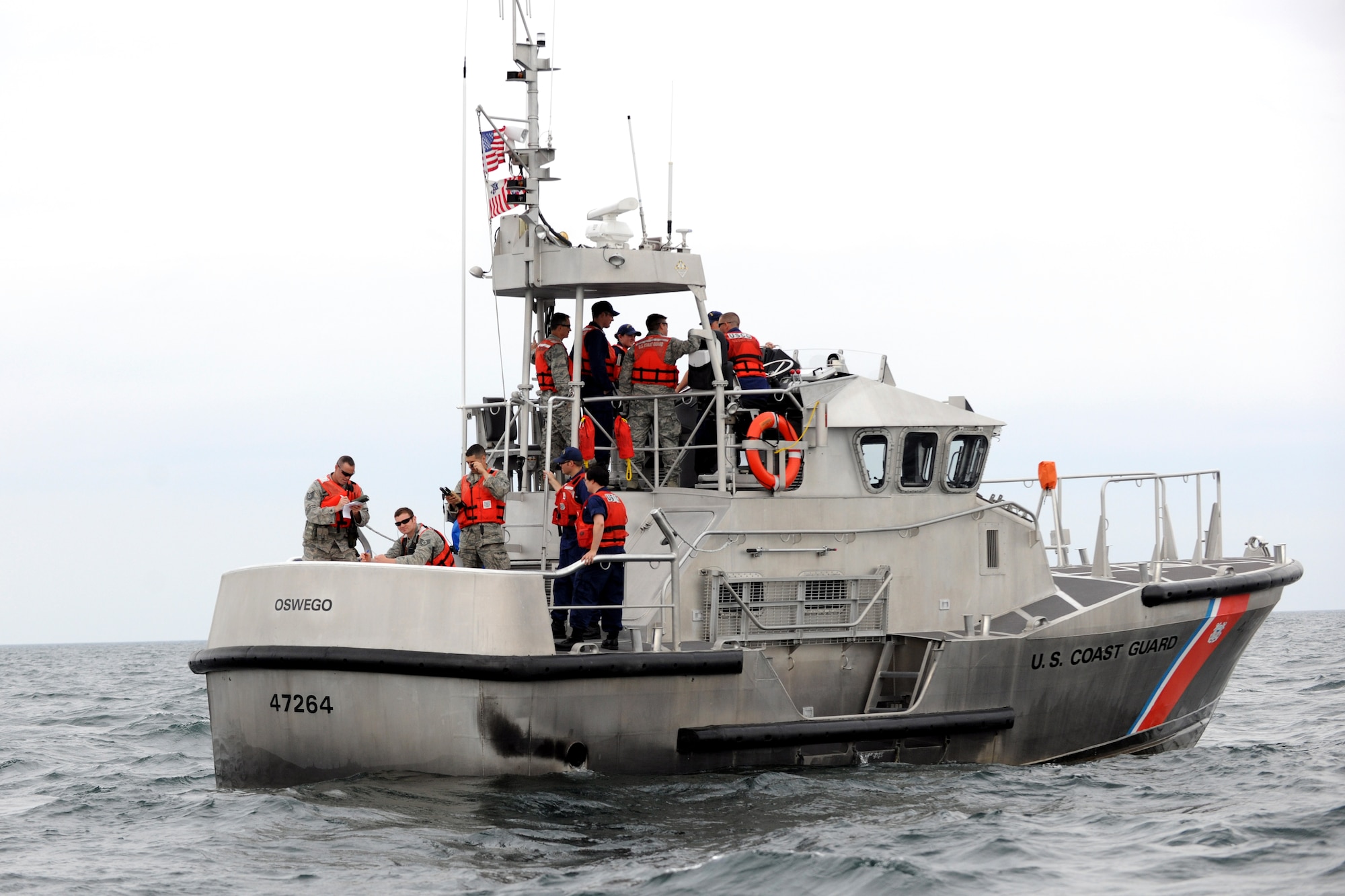 Airmen from the New York Air National Guard’s 274th Air Support Operations Squadron stationed at Hancock Field Air National Guard Base, Syracuse, New York use global positioning satellite and other communications equipment aboard a U.S. Coast Guard cutter during a training operation on Lake Ontario on June 18, 2012.  The communications equipment enabled the Airmen to talk directly with the aircrew of a MQ-9 Reaper remotely piloted aircraft (RPA) from the 174th Fighter Wing as well as view feeds directly from the aircraft in real time. This was a first-of-its-kind joint operation with the U.S. Coast Guard, N.Y. Naval Militia and the 174th Fighter Wing to train in different maritime operations involving the MQ-9. (New York Air National Guard photo by Tech. Sgt. Jeremy M. Call/Released)