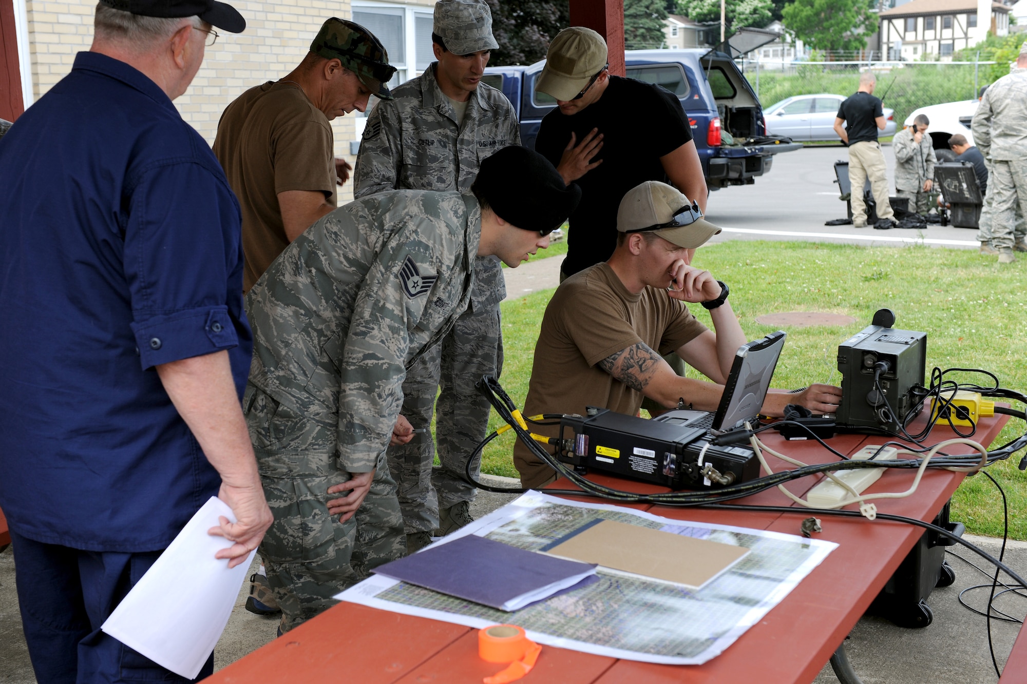 Airmen from the New York Air National Guard’s 274th Air Support Operations Squadron stationed at Hancock Field Air National Guard Base, Syracuse, New York set up communications equipment at the U.S. Coast Guard station in Oswego on June 18, 2012.  The communications equipment enabled the Airmen to talk with the aircrew of a MQ-9 Reaper remotely piloted aircraft (RPA) from the 174th Fighter Wing as well as view feeds directly from the aircraft in real time. The Airman were participating in a first-of-its-kind joint operation with the U.S. Coast Guard, N.Y. Naval Militia and the 174th Fighter Wing to train in different maritime rescue operations where an RPA could assist. (New York Air National Guard photo by Tech. Sgt. Jeremy M. Call/Released)