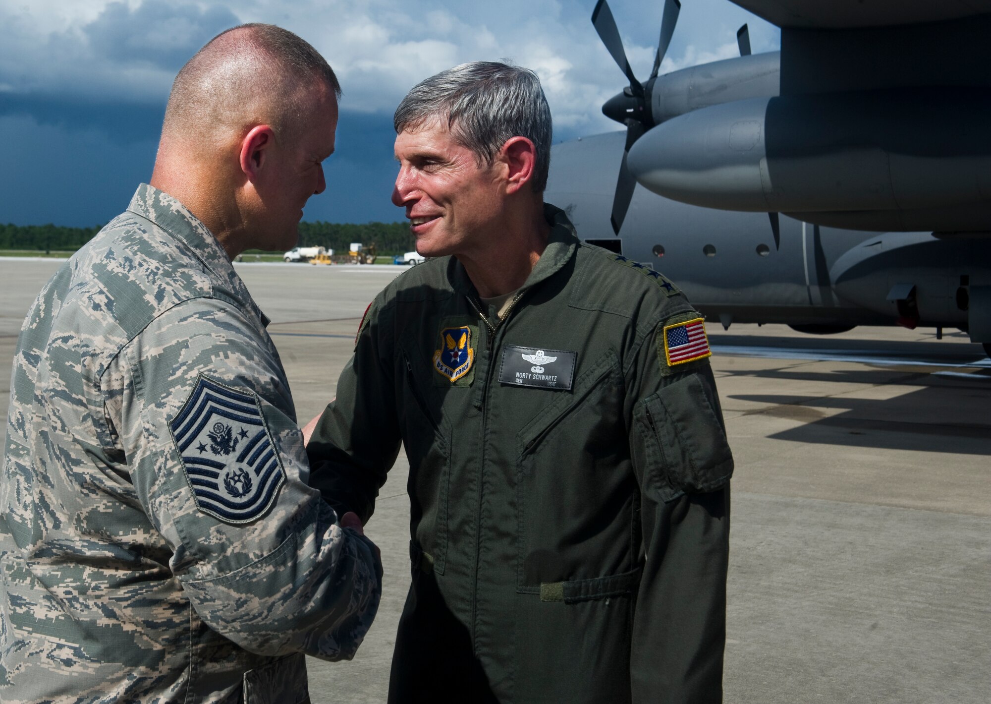 Air Force Chief of Staff Gen. Norton Schwartz shakes hands with Chief Master Sgt. of the Air Force James Roy, July 12, 2012, at Hurlburt Field, Fla., following his last flight as an active-duty officer on an MC-130E Combat Talon I. The MC-130E Combat Talon I crew conducted a local training sortie during the mission. It also served as Schwartz's "fini flight" in the Air Force. (U.S. Air Force photo / Airman 1st Class Christopher Williams) (Released)