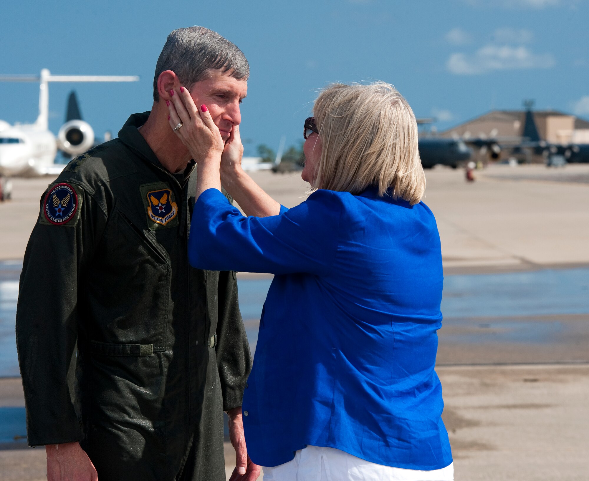 Air Force Chief of Staff Gen. Norton Schwartz is embraced by his wife Susie July 12, 2012, at Hurlburt Field, Fla., following his last flight as an active-duty officer on an MC-130E Combat Talon I. The MC-130E Combat Talon I crew conducted a local training sortie during the mission. It also served as Schwartz's "fini flight" in the Air Force. (U.S. Air Force photo / Airman 1st Class Christopher Williams) (Released)