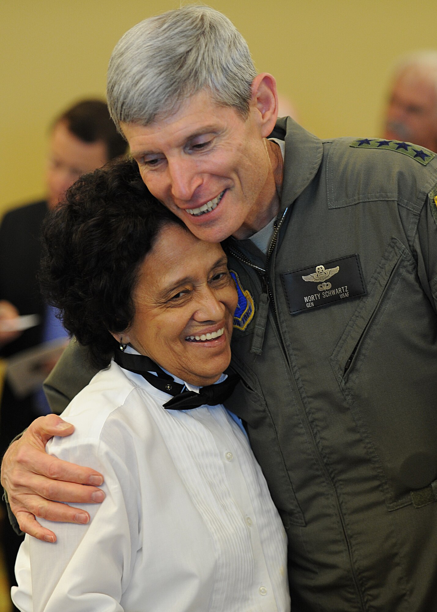 Air Force Chief of Staff Gen. Norton Schwartz hugs a member of the Soundside Club staff at Hurlburt Field, Fla., July 12, 2012. Schwartz visited the base to meet with Air Force Special Operations Command leaders and airmen. During the visit, he flew his last flight as an active-duty officer on an MC-130E Combat Talon I. The MC-130E crew conducted a local training sortie during the mission. It also served as Schwartz's "fini flight" in the Air Force. (U.S. Air Force photo / Airman 1st Class Christopher Williams) (Released)