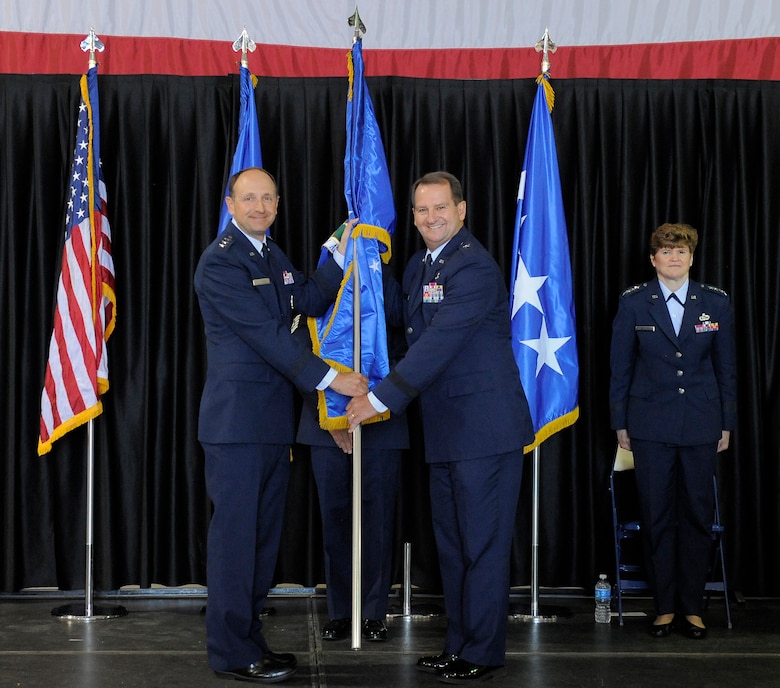 Lt. Gen. Bruce Litchfield, commander of the Air Force Sustainment Center at Tinker Air Force Base, Okla., officially designates Brig. Gen. H. Brent Baker Sr. as the commander of the Ogden Air Logistics Complex at Hill Air Force Base July 12. The complex’s consolidation with the Air Force Sustainment Center is part of an Air Force Materiel Command effort that reduces the command’s number of centers from 12 to five. (U.S. Air Force photo/Todd Cromar)