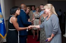 Incoming 42nd Air Base Wing commander Col. Trent Edwards and his wife Vanessa receive a welcome from Maxwell Air Force Base personnel during the reception at the Maxwell Club following the change of command ceremony on June 28. (U.S. Air Force photo by Melanie Rodgers Cox)
