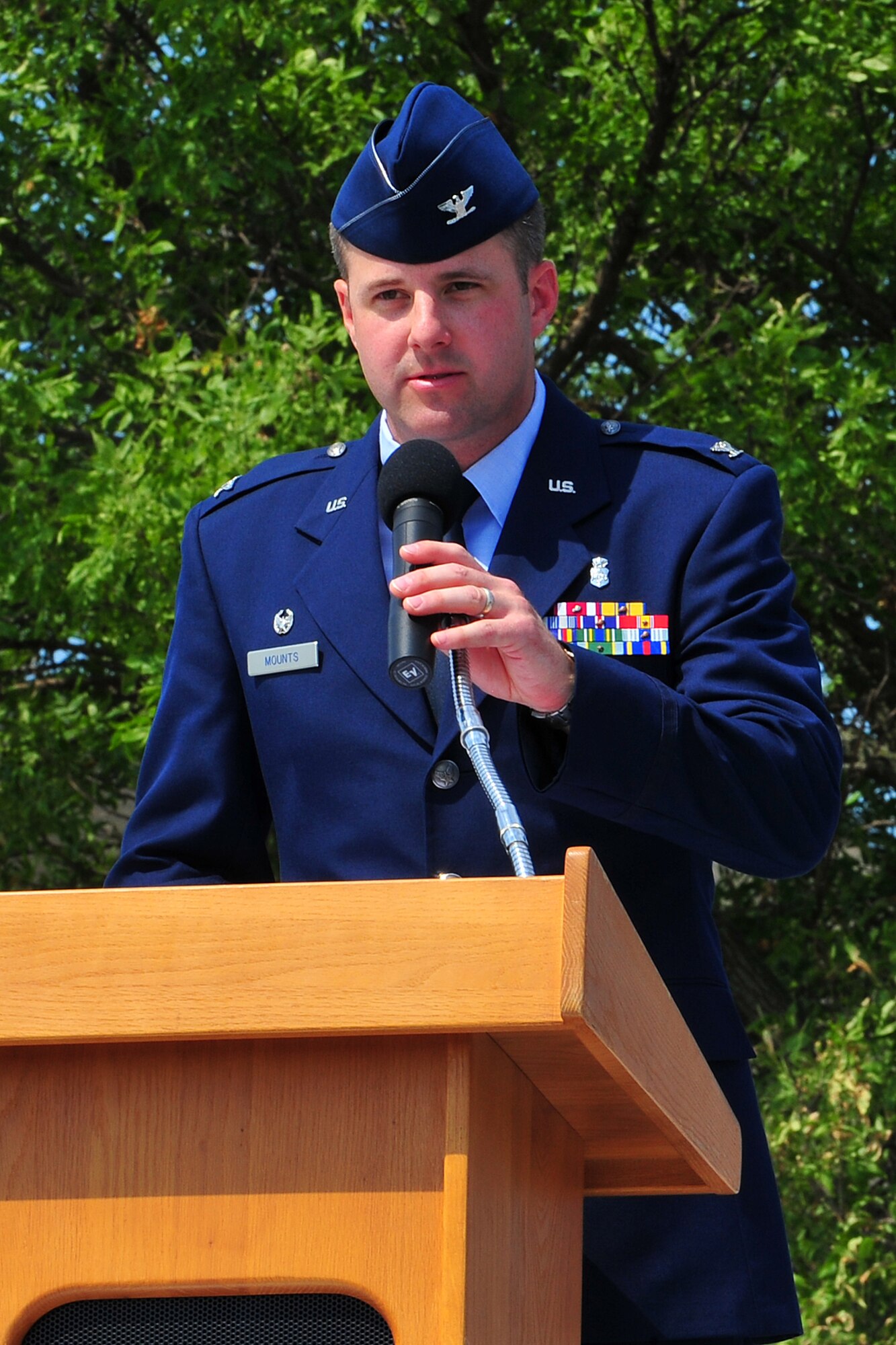 U.S. Air Force Col. Stephen Mounts, 55th Medical Group commander, speaks to the crowd during the 55th Medical Group change of command ceremony held outside the Ehrling Bergquist Clinic on Offutt Air Force Base, Neb., July 12. As the new 55th MDG commander, Mounts is responsible for a four squadron, 718-person health care delivery system providing care to more than 47,000 Department of Defense beneficiaries. 