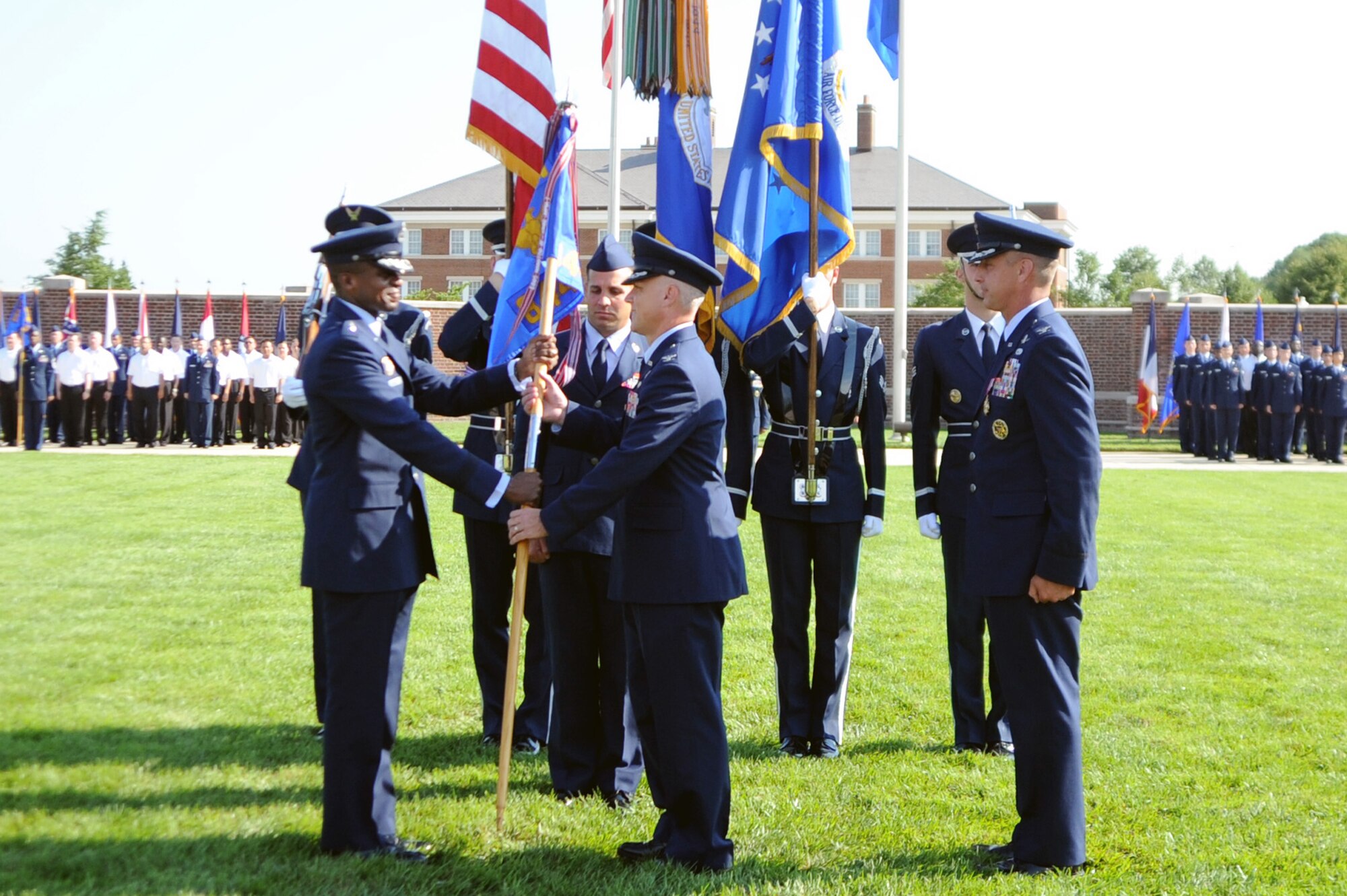 Col. Kevin M. Payne (center) accepts command of the 844th Communications Group from Air Force District of Washington Commander Maj. Gen. Darren W. McDew during a change-of-command ceremony July 12 on the Air Force Ceremonial Lawn, Joint Base Anacostia-Bolling, Washington, D.C. (U.S. Air Force photo by Airman 1st Class Tabitha N. Haynes)
