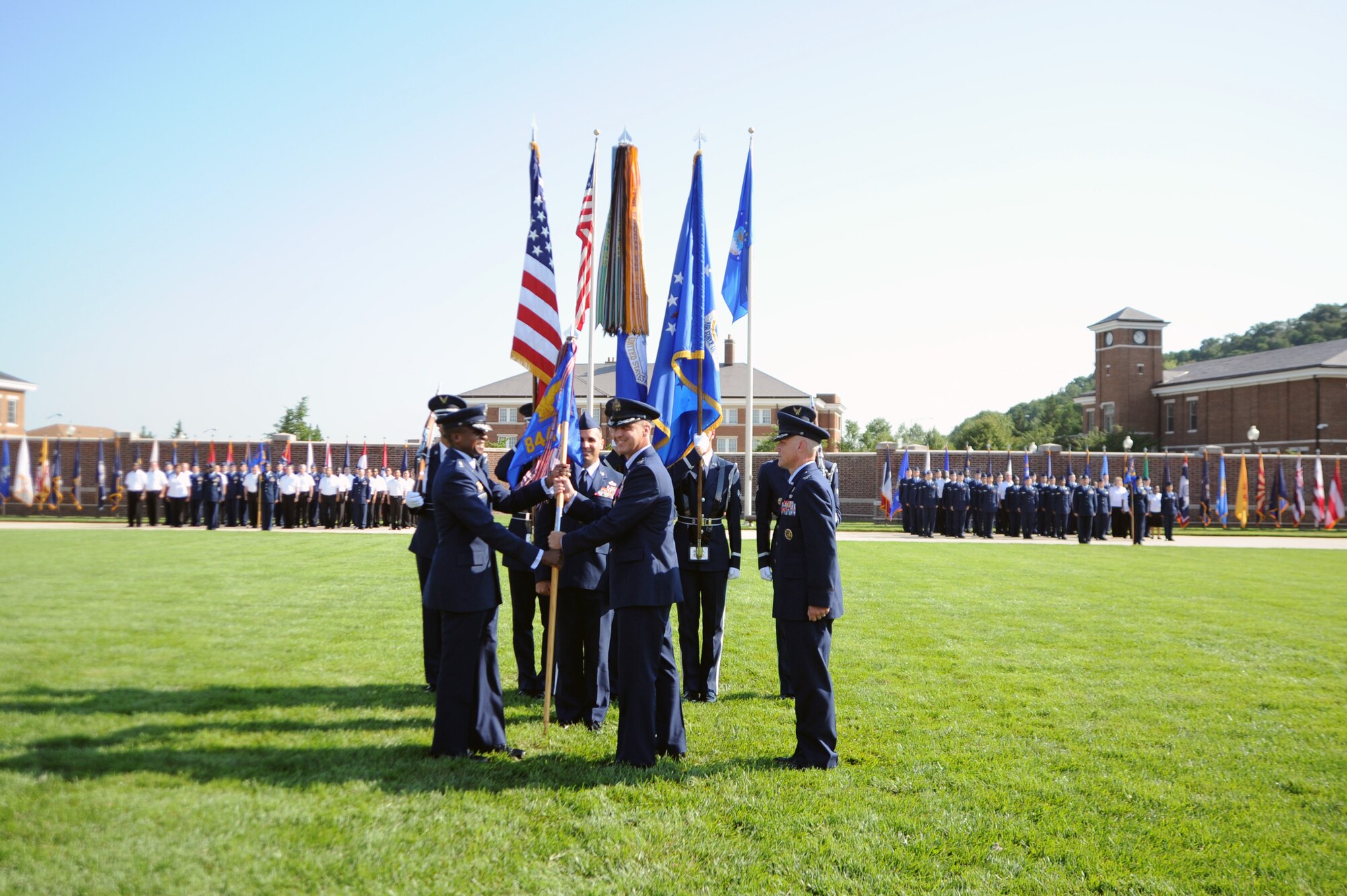 Col. Anthony J. Thomas (center) relinquishes command of the 844th Communications Group to Col. Kevin M. Payne (right) during a change-of-command ceremony July 12 on the Air Force Ceremonial Lawn, Joint Base Anacostia-Bolling, Washington, D.C. Air Force District of Washington Commander Maj. Gen. Darren W. McDew (left) presided over the ceremony. (U.S. Air Force photo by Airman 1st Class Tabitha N. Haynes) 