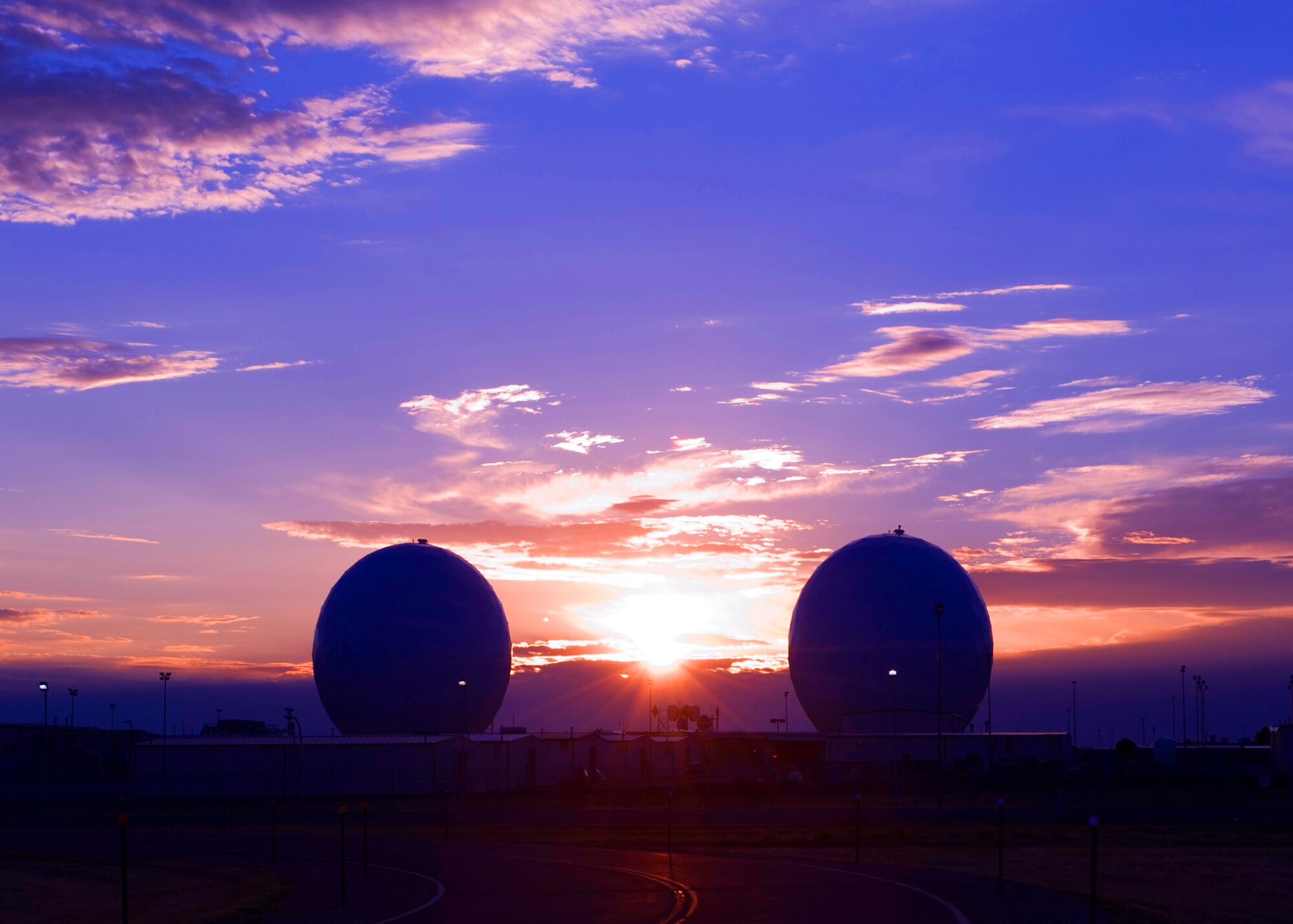 BUCKLEY AIR FORCE BASE – The “golf balls” at Buckley stand vigil as the sun rises at the mile-high base Aug. 29, 2011.  The 460th Operations Group satellites maintain Buckley’s space-based missile warning system. (U.S. Air Force photo by Senior Airman Marcy Glass) 