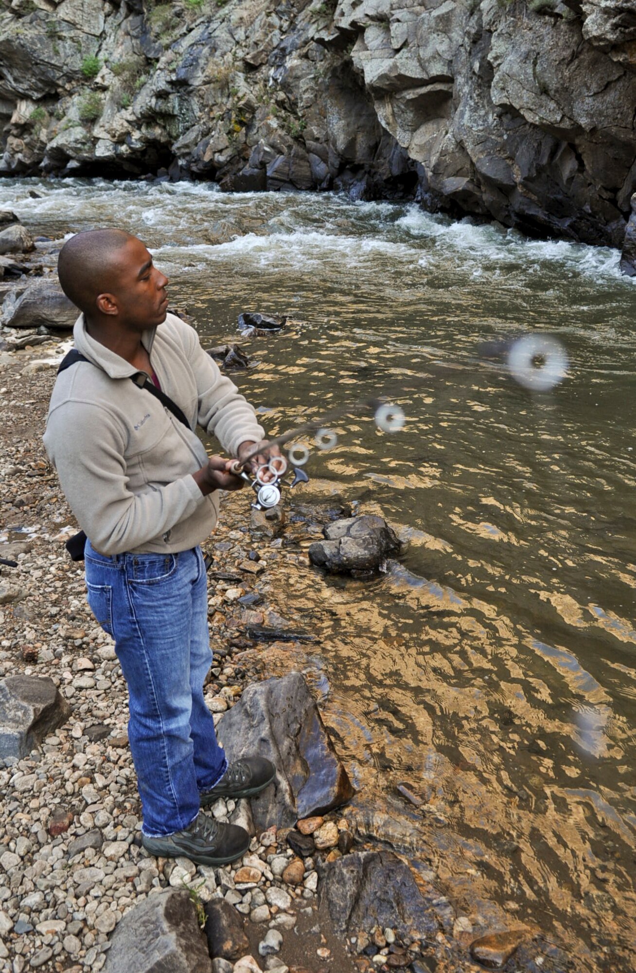 CLEAR CREEK, Colo. – Paul Labbe, 460th Space Wing Public Affairs, prepares to cast into Clear Creek July 10, 2012. Clear Creek is one of many Colorado fishing destinations where anglers are able to fish for Brown, Brook, Rainbow and Cutthroat trout, Cutthroat being a Colorado native trout. (U.S. Air Force photo/Senior Airman Christopher Gross)