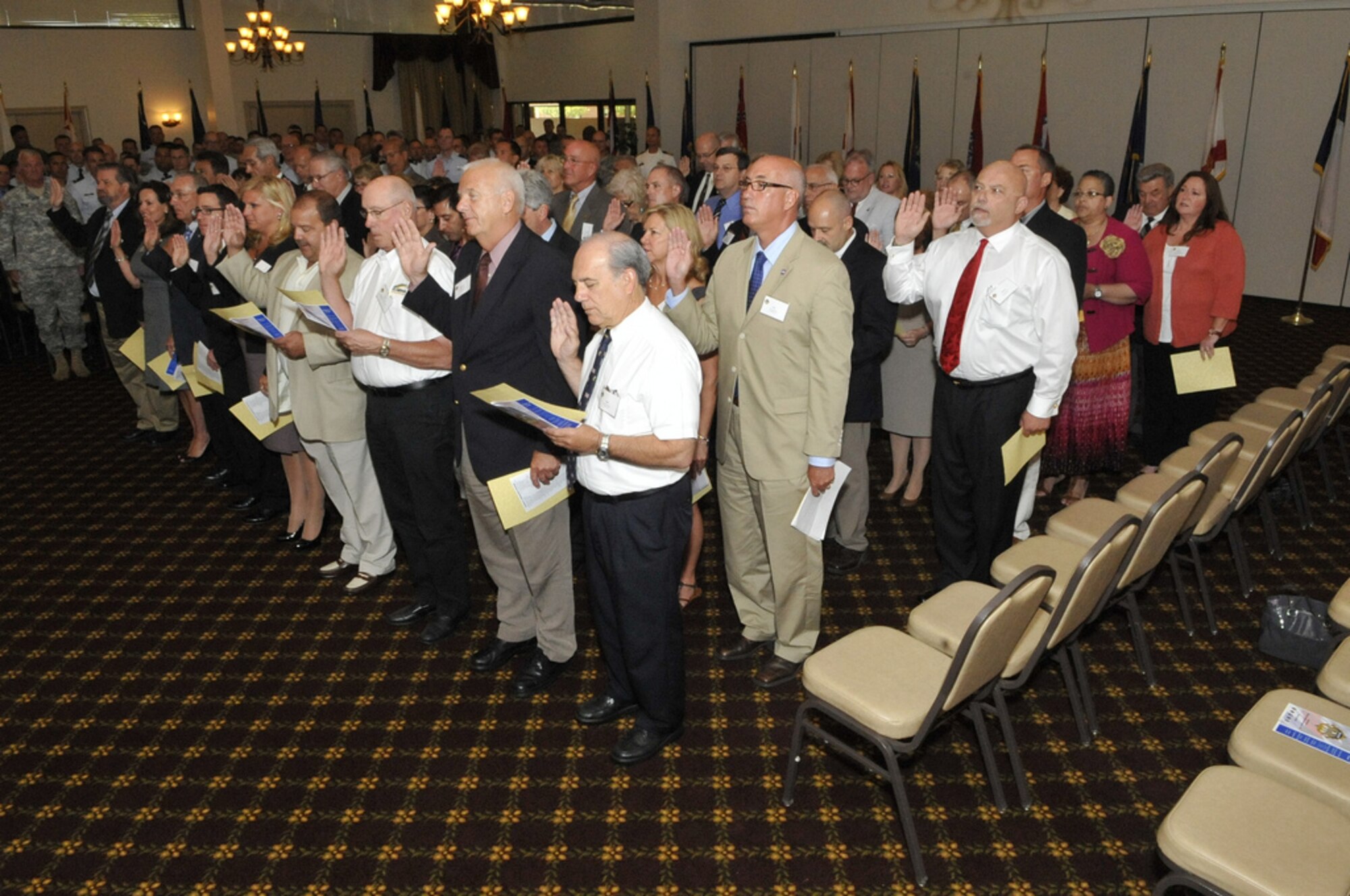 Honorary Commanders of Joint Base McGuire-Dix-Lakehurst take the Honorary Commander's Oath during the Induction Ceremony here July 2. The Honorary Commanders’ program encourages an exchange of ideas, experiences and friendships between key leaders of the surrounding communities and JB MDL. (U.S. Air Force photo by Wayne Russell/Released)