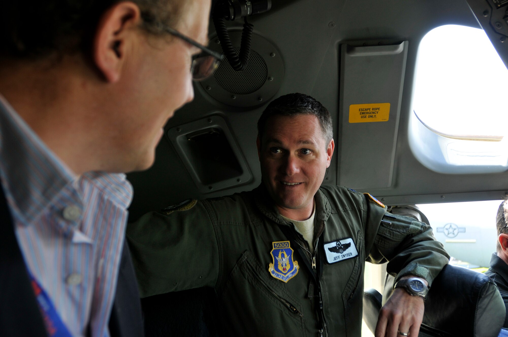 FARNBOROUGH, England - Lt. Col. Jeff Snyder, 326th Airlift Squadron aircraft commander, talks with a visitor about the various capabilities of a C-17 Globemaster III, July 11, 2012, during the Farnborough International Air Show in Farnborough, England. Approximately 90 aircrew and support personnel from bases in Europe and the United States are participating in the air show. Participation in this premier event demonstrates that U.S. defense industry offers state-of-the-art capabilities vital for the support and protection of our allies' and partners' national-security interests. (U.S. Air Force photo by Tech. Sgt. Lee A. Osberry Jr.)