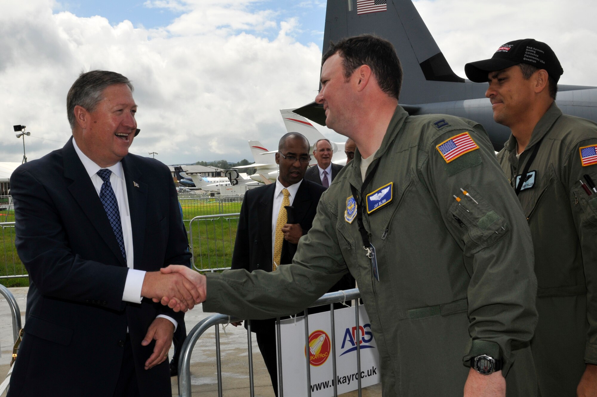 FARNBOROUGH, England - Secretary of the Air Force Michael Donley shakes hands with Capt. Jay Blinn, 3rd Airlift Squadron pilot, July 10, 2012, during a visit to the Farnborough International Air Show in Farnborough, England. Approximately 90 aircrew and support personnel from bases in Europe and the United States are participating in the air show. Participation in this premier event demonstrates that U.S. defense industry offers state-of-the-art capabilities vital for the support and protection of our Allies' and Partners' national-security interests. (U.S. Air Force photo by Tech. Sgt. Lee A. Osberry Jr.)