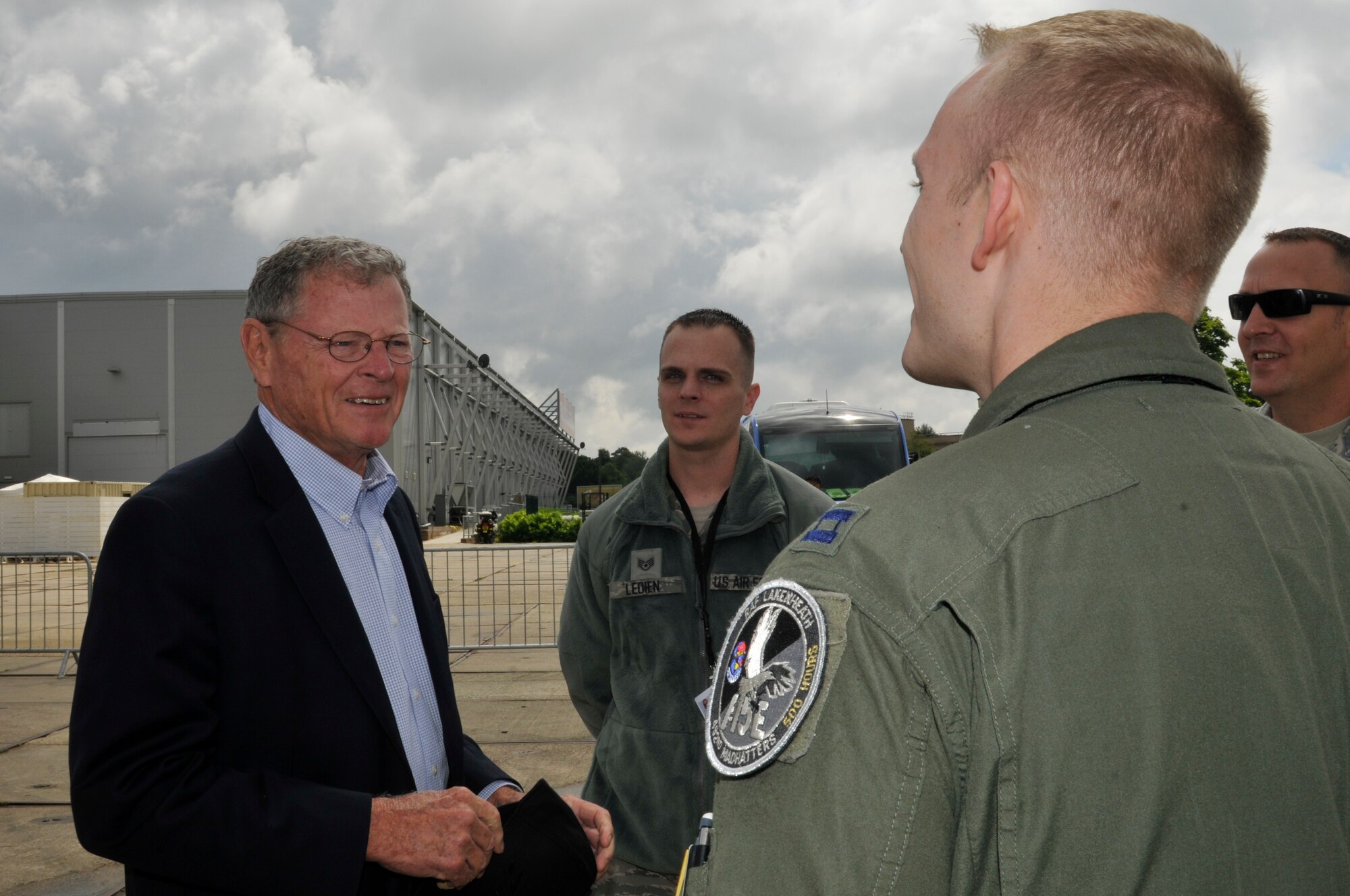 FARNBOROUGH, England - Sen. James Inhofe of Oklahoma chats with U.S. Air Force Capt. Reid Thomas, 492nd Fighter Squadron pilot, July 8, 2012, during the Farnborough International Air Show in Farnborough, England. Approximately 90 aircrew and support personnel from bases in Europe and the U.S. participated in the air show. The world renowned event exhibits the latest in aerospace equipment and technology. (U.S. Air Force photo by Tech. Sgt. Lee A. Osberry Jr.)