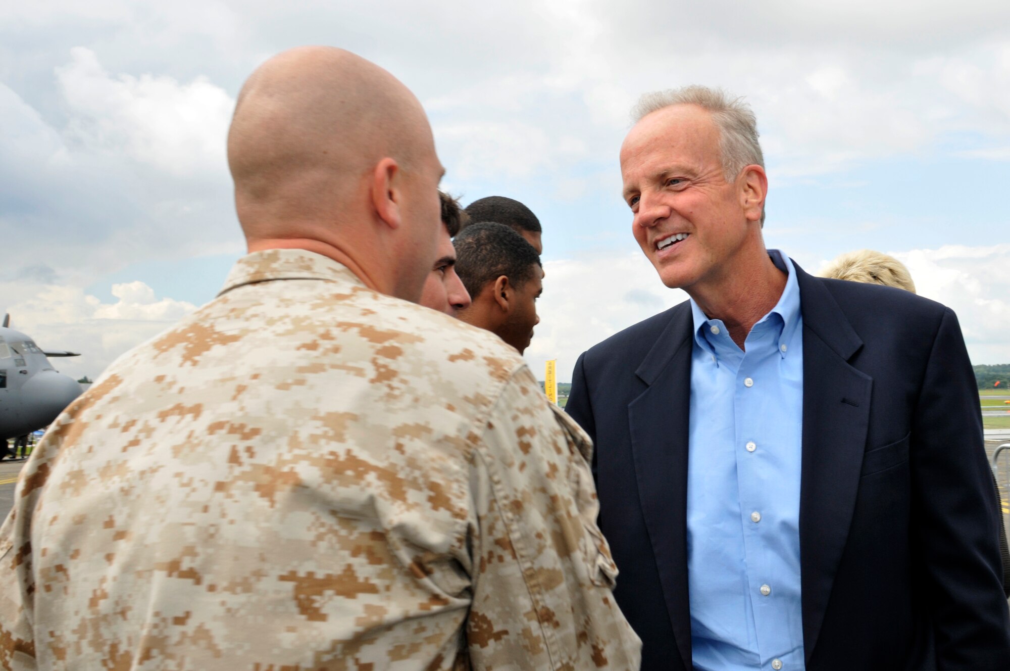 FARNBOROUGH, England - Sen. Jerry Moran of Kansas is greeted by U.S. Marine Corps Staff Sgt. George Singer, Marine Medium Tiltrotor Squadron 264 tool room staff non-commissioned officer in charge, July 8, 2012, during the Farnborough International Air Show in Farnborough, England. Approximately 90 aircrew and support personnel from bases in Europe and the U.S. are participating in the air show. The world renowned event exhibits the latest in aerospace equipment and technology. (U.S. Air Force photo by Tech. Sgt. Lee A. Osberry Jr.)