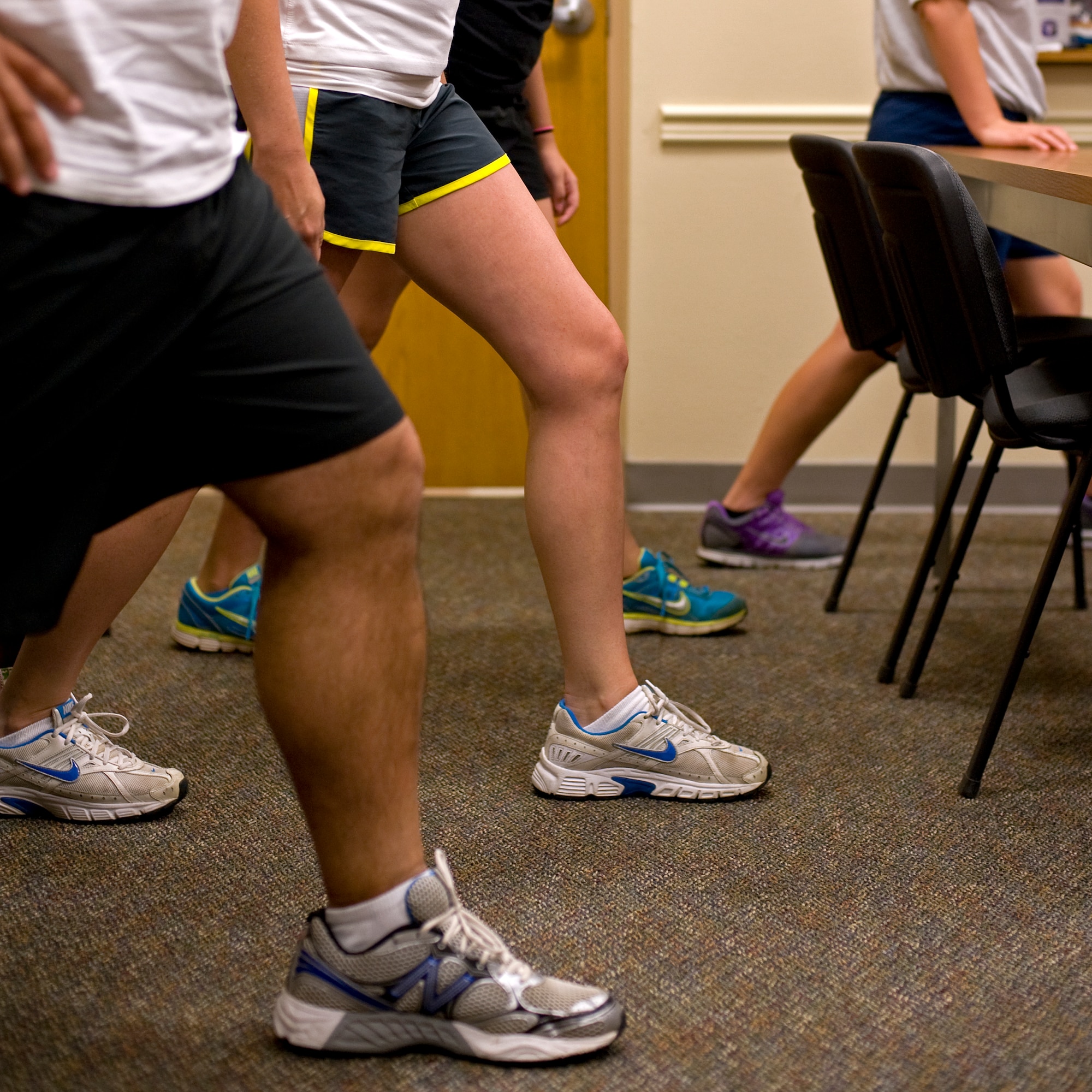 Participants practice a calf stretch during the running clinic in the Health and Wellness Center at Hurlburt Field, Fla., July 11, 2012. Maintaining the physical resiliency of Airmen ensures they are fit to fight.  (U.S. Air Force photo/Airman 1st Class Michelle Vickers) (RELEASED) 
