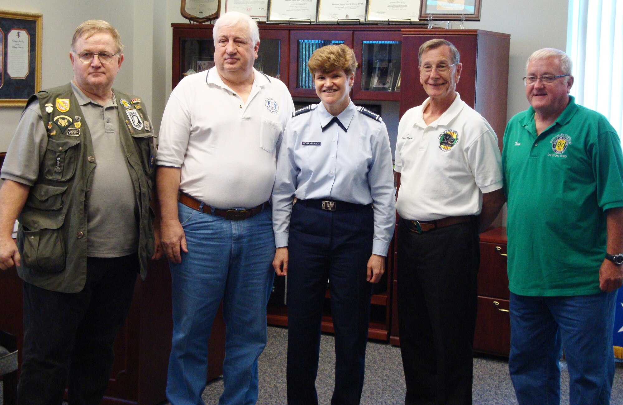Gen. Janet Wolfenbarger, commander of Air Force Materiel Command, meets with a group of local Vietnam veterans on July 9, 2012.  (From left) David Fuchs, Steve Ratcliffe, General Wolfenbarger, Richard Barazzotto and Tom Istvan pose for a photo during the small gathering in the general’s office.  The veterans are four of the five who were selected to participate in the 2012 AFMC Freedom’s Call Tattoo ceremony.  General Wolfenbarger invited the group to meet with her following the cancellation of the event due to severe weather.  The theme of this year’s Tattoo was “Service, Honor and Sacrifice” and was intended to commemorate the veterans who served their country during the Vietnam War.  According to Tattoo Director Dave Egner, plans are already in progress to make their service a centerpiece of the next Tattoo.  (U.S. Air Force photo/Michelle Martz)