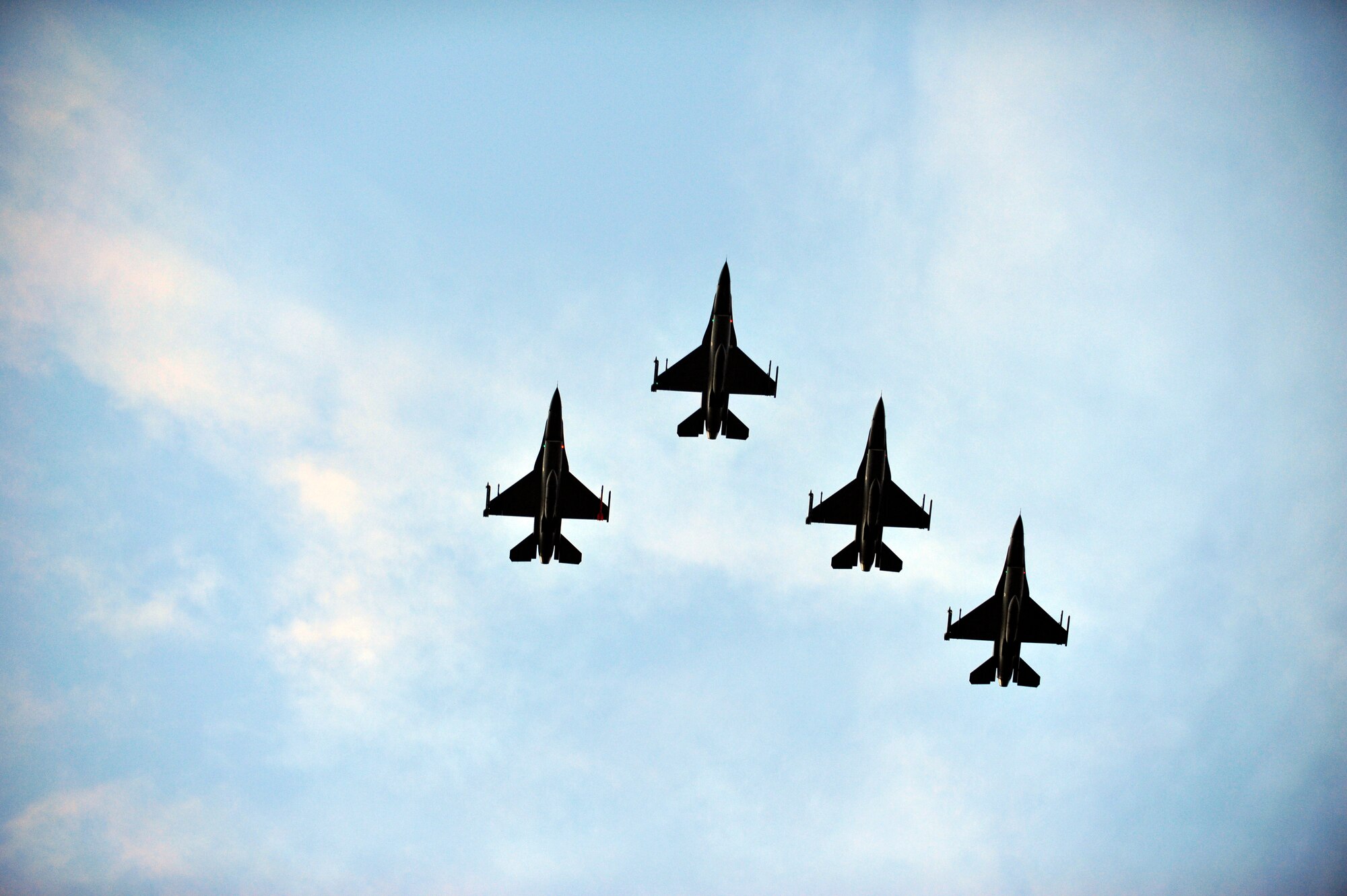 The 62nd Fighter Squadron performs a four-ship flyover to open the festivities. (U.S. Air Force photo by Staff Sgt. Jason Colbert)
