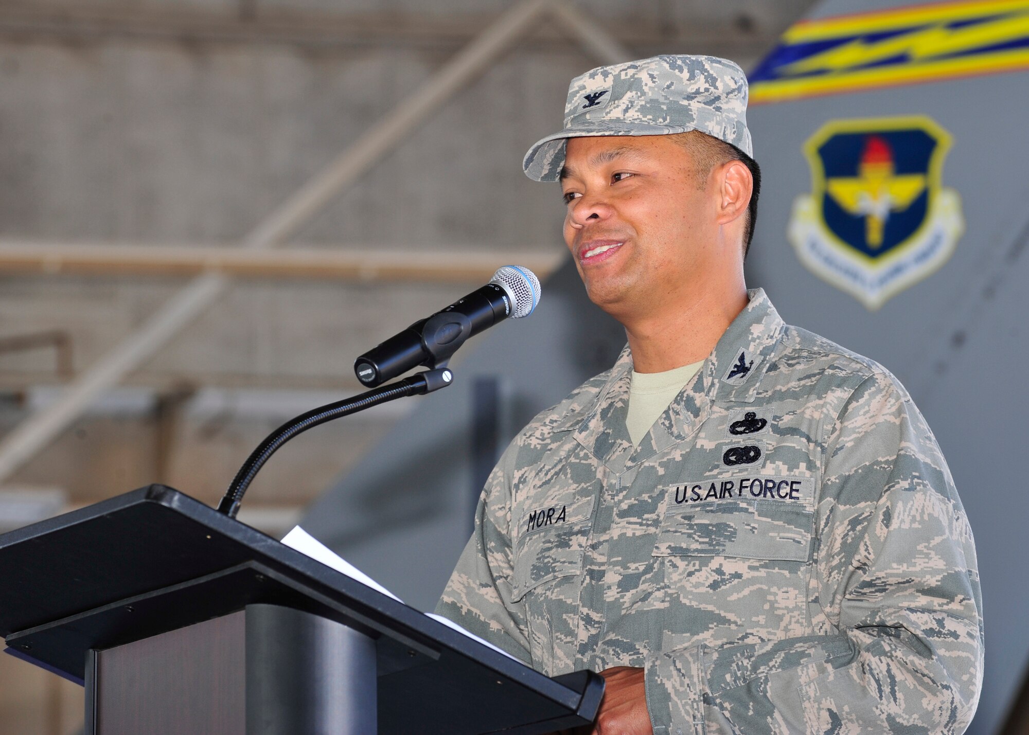 Col. Victor Mora speaks to the Airmen of the 56th Maintenance Group during a change-of-command ceremony July 10 at Luke Air Force Base. (U.S. Air Force photo by Staff Sgt. Jason Colbert)	