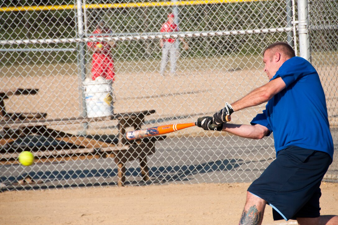 KENT, Ohio -- Master Sgt. Scott Smith, 910th Medical Squadron healthcare services manager, bats during one of the 910th Airlift Wing Air Force Falcons make up game at Allerton Field in Kent, Ohio, July 10, 2012. The Falcons softball team consists of Youngstown Air Reserve Station servicemembers and civilians who participate in this men's summer softball league. (U.S. Air Force photo/Staff Sgt. Megan Tomkins)