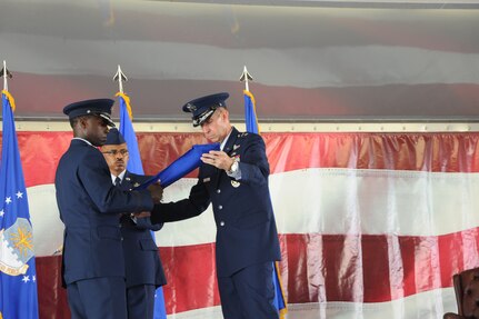 Gen. Edward A. Rice Jr., Air Education and Training Command commander, and Maj. Gen. Mark Solo, 19th AF commander, case the 19th AF flag at the inactivation ceremony held at Joint Base San Antonio-Randolph, Texas, July 12. (U.S. Air Force photo by Rich McFadden) 