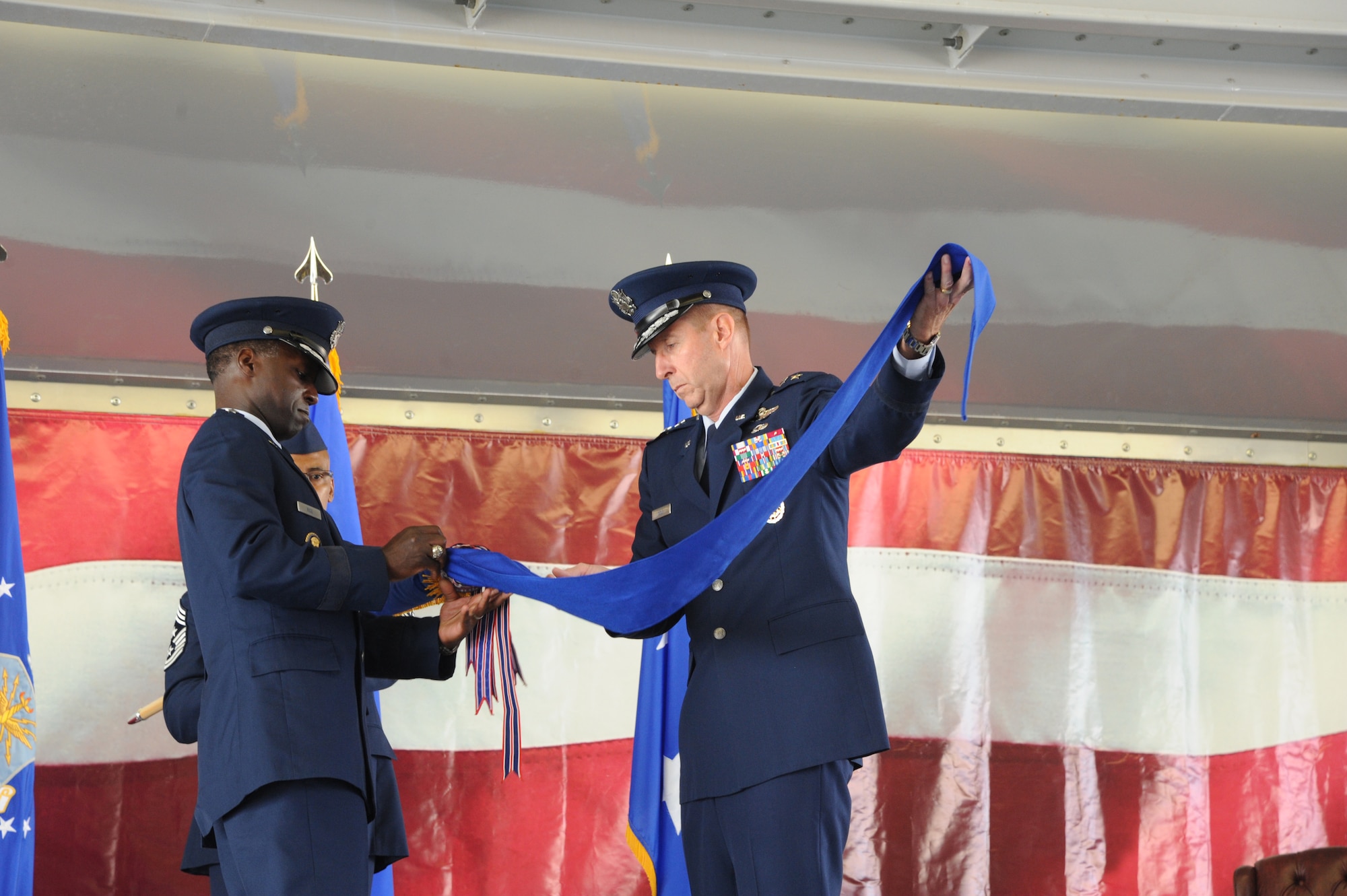 Gen. Edward A. Rice Jr., Air Education and Training Command commander, and Maj. Gen. Mark Solo, 19th AF commander, case the 19th AF flag at the inactivation ceremony held at Joint Base San Antonio-Randolph, Texas, July 12. (U.S. Air Force photo by Rich McFadden) 