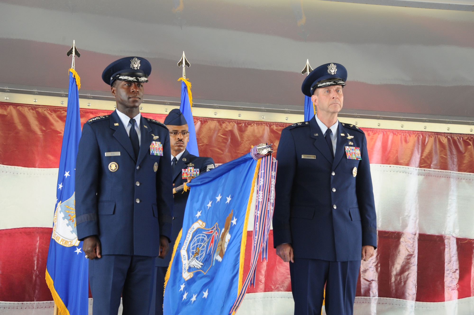 Gen. Edward A. Rice Jr. (left), Air Education and Training Command commander, and Maj. General Mark Solo, 19th Air Force commander, furl the 19th AF flag at the inactivation ceremony held at Joint Base San Antonio-Randolph, Texas, July 12. (U.S. Air Force photo by Rich McFadden)  