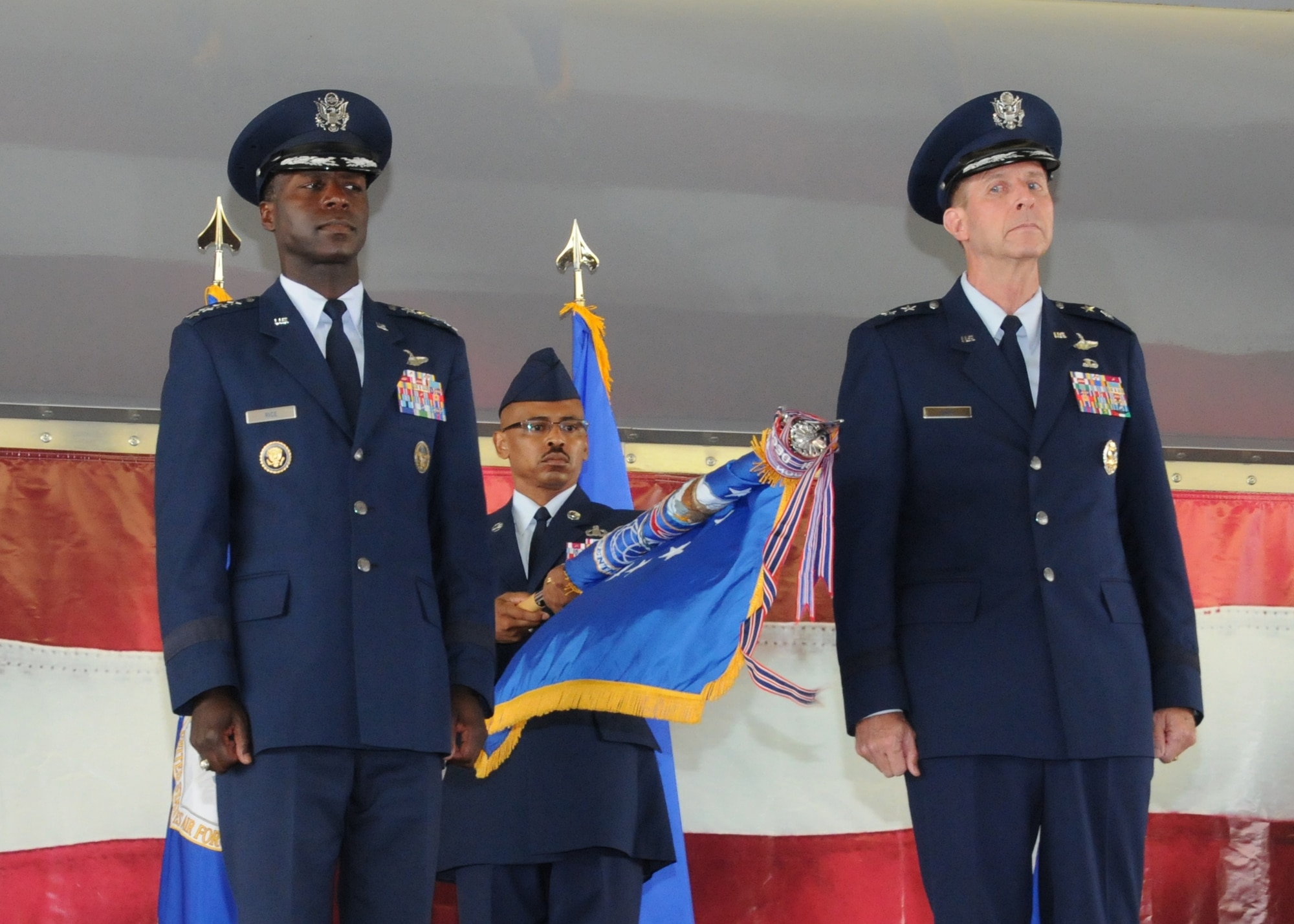 Gen. Edward A. Rice Jr. (left) Air Education and Training Command commander, and Maj. Gen. Mark Solo, 19th Air Force commander, furl the 19th AF flag at the inactivation ceremony held at Joint Base San Antonio-Randolph, Texas, July 12. (U.S. Air Force photo by Melissa Peterson)