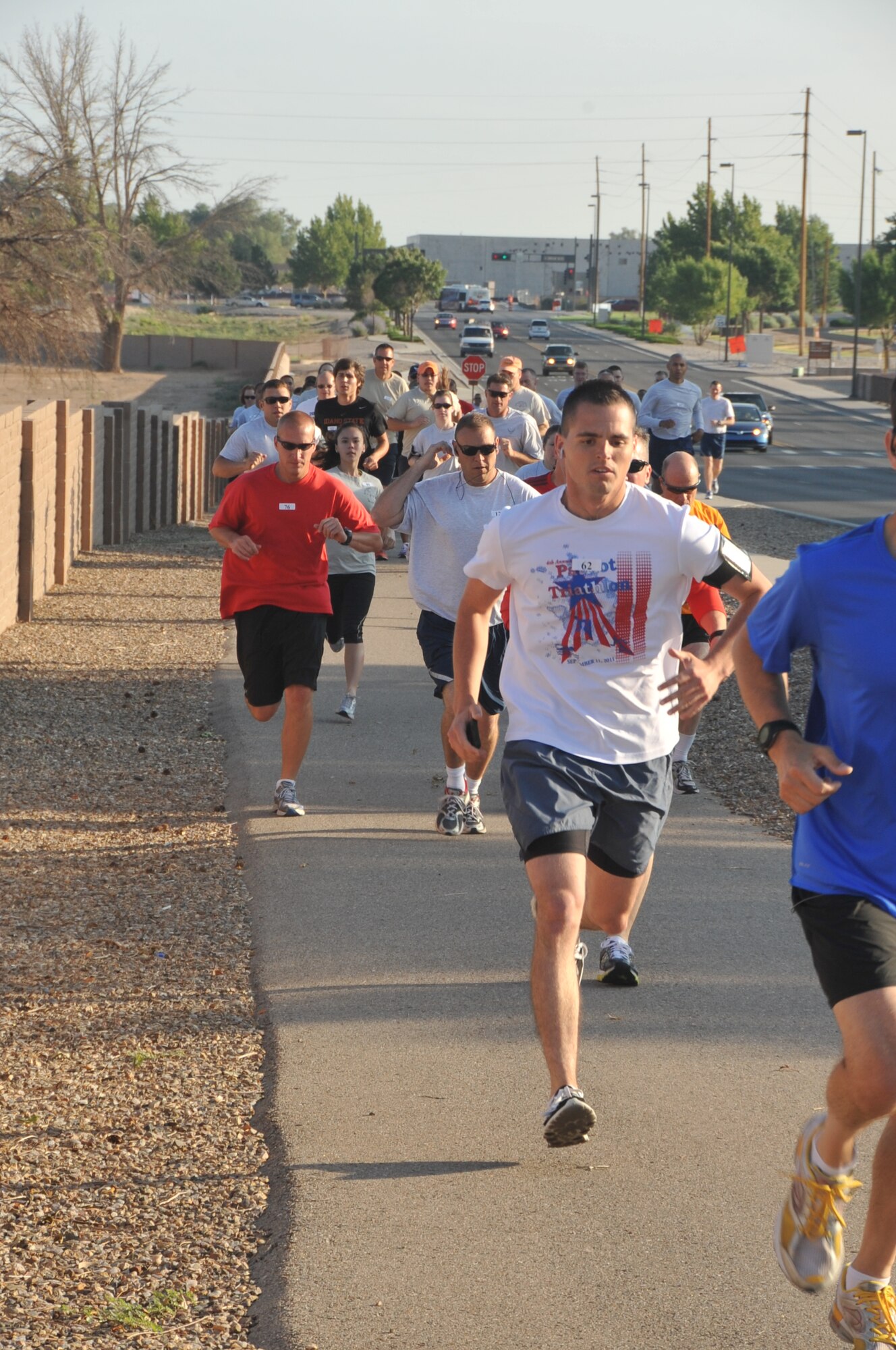 KIRTLAND AFB, N.M. -- Members of Team Kirtland participated in the third annual Top 3 5k run Wednesday at Kirtland Air Force Base. Winners were Airman 1st Class Dominik Kosgel, men 24 and under; Jessica Ward, women 24 and under; Senior Airman Jed Morris, men 25 to 35; Tech. Sgt. Kristy Nelson, women 25 to 35; Col. Marcus Schulthess, men 36 and over; and Imelda Terrill, women 36 and over. Proceeds from the event will support the Senior NCO induction ceremony, E1 through E6 scholarships, and Airmen recognition programs. (Photo by Todd Berenger)