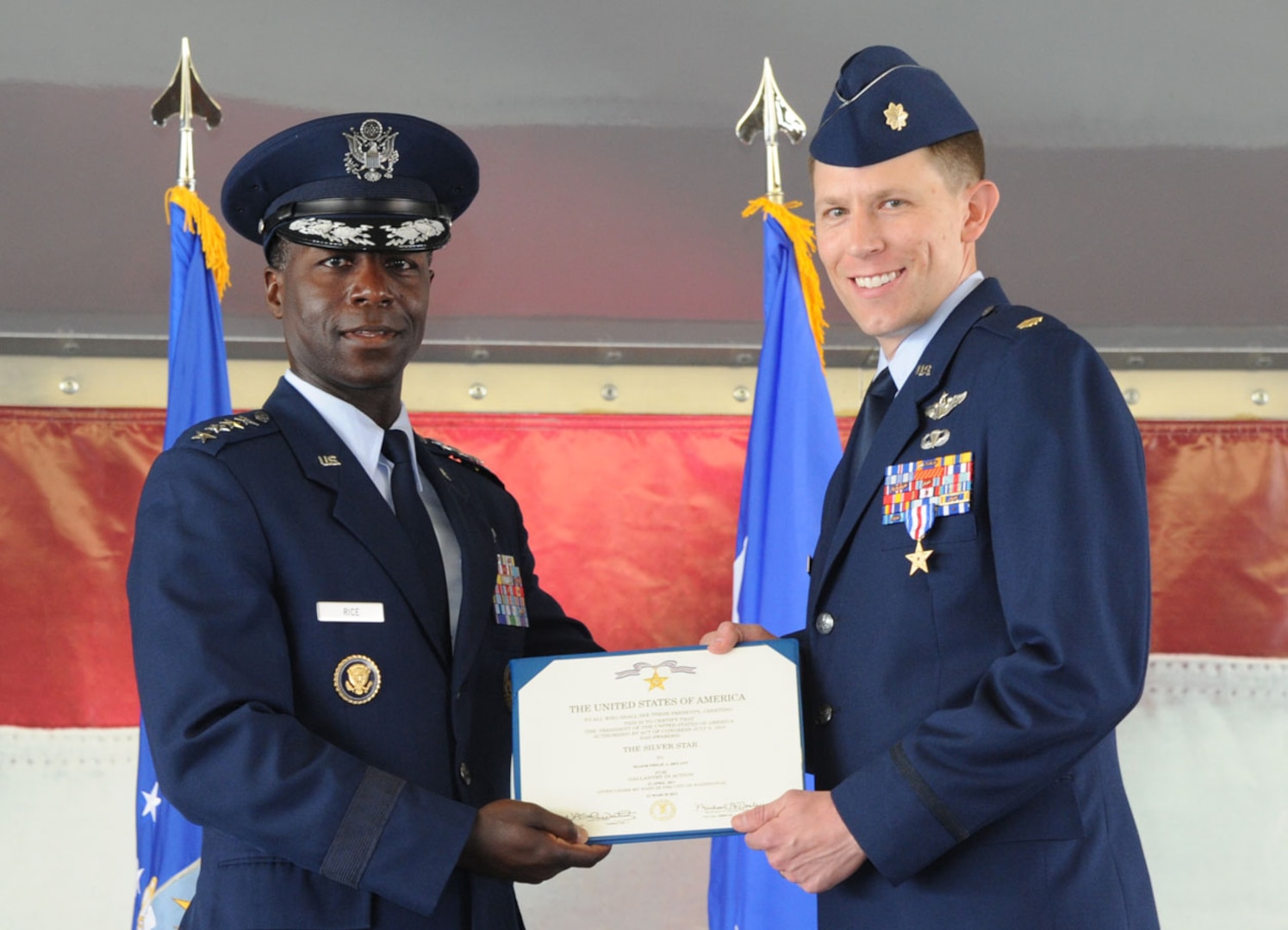Maj. Philip Bryant, combat search and rescue pilot, was presented the
Silver Star medal at the 19th Air Force's inactivation ceremony Thursday at
Joint Base San Antonio-Randolph.  Gen. Edward A. Rice, Jr., Air Education
Training Command commander, presented the third highest military decoration
to Bryant for his participation in a recovery mission of two U.S. Army
pilots who were downed in the Allasay Valley, an enemy controlled area east
of Bagram Airfield, Afghanistan on April 23, 2011.  (U.S. Air Force photo by Rich McFadden)