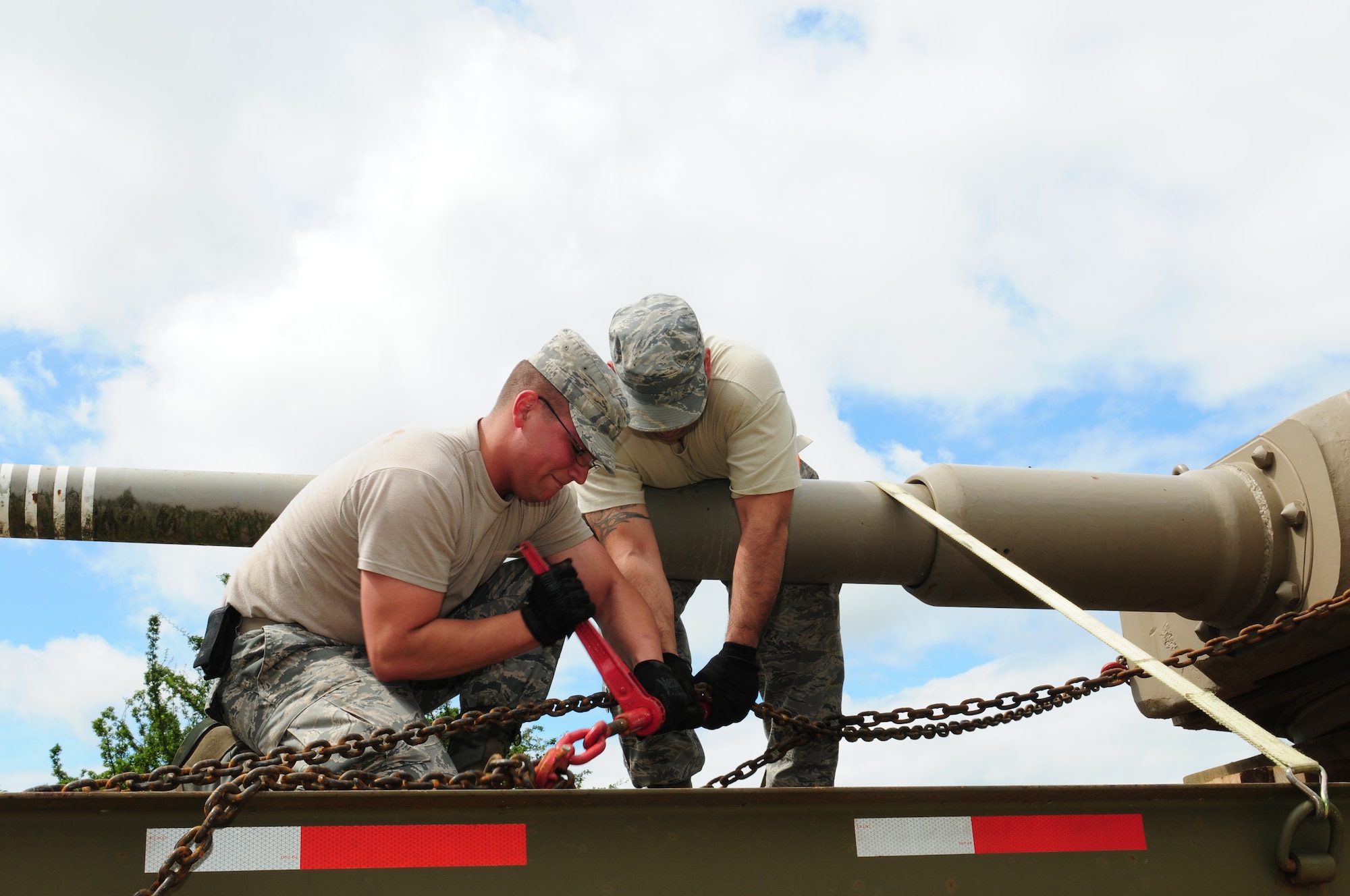 ROYAL AIR FORCE ALCONBURY, England – Airman 1st Class Steven Bueso (left), 48th Logistics Readiness Squadron vehicle operator, and Staff Sgt. Rafael Bernal, 48th LRS vehicle dispatcher, secure a Tiger 1 turret July 9, 2012.  The Tiger 1, one of six left in the world, will be shipped to the U.S. Army Armor and Cavalry Museum at Fort Benning, Ga., for repair and full restoration. (U.S. Air Force photo by Airman 1st Class Cory D. Payne)