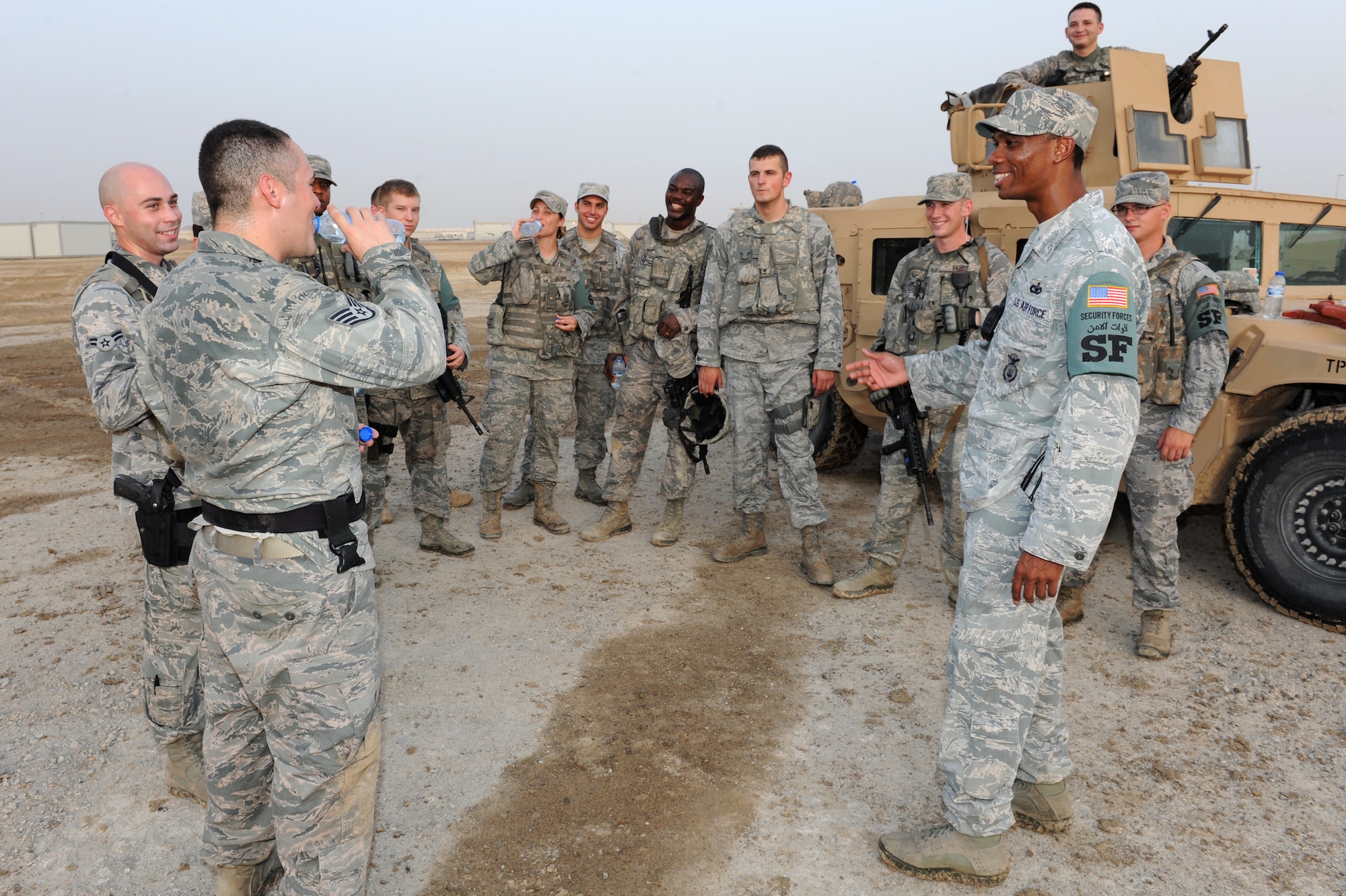 SOUTHWEST ASIA - Tech. Sgt. Scottie Boyd, 380th Expeditionary Security Forces Squadron Quick Response Force Bravo Flight NCO in charge, also known as Scorpion Lead, conducts a post-exercise brief with his QRF Airmen July 12, 2012. Boyd conducts these exercises to keep his team sharp and ready. (U.S. Air Force photo/Master Sgt. Scott MacKay)