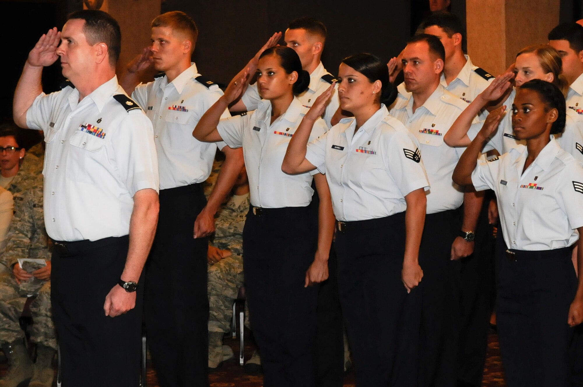 The 18th Dental Squadron presents their first salute to U.S. Air Force Lt. Col. Robin Fontenot, commander of the 18th Dental Squadron, during his change of command ceremony on Kadena Air Base, July 13, 2012. Fontenot is responsible for 136 personnel, the oral healthcare of over 17,000 beneficiaries and $23 million in equipment and facilities. (U.S. Air Force photo/Airman Tara A. Williamson)