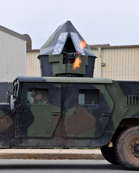 A Humvee returns fire while responding to a simulated attack during exercise Beverly Midnight 12-03 on Kunsan Air Base, Republic of Korea, July 11, 2012. Members of the 8th Security Forces Squadron were attempting to retake a compound that opposing-forces role players had taken control of. (U.S. Air Force photo/Staff Sgt. Jonathan Fowler)