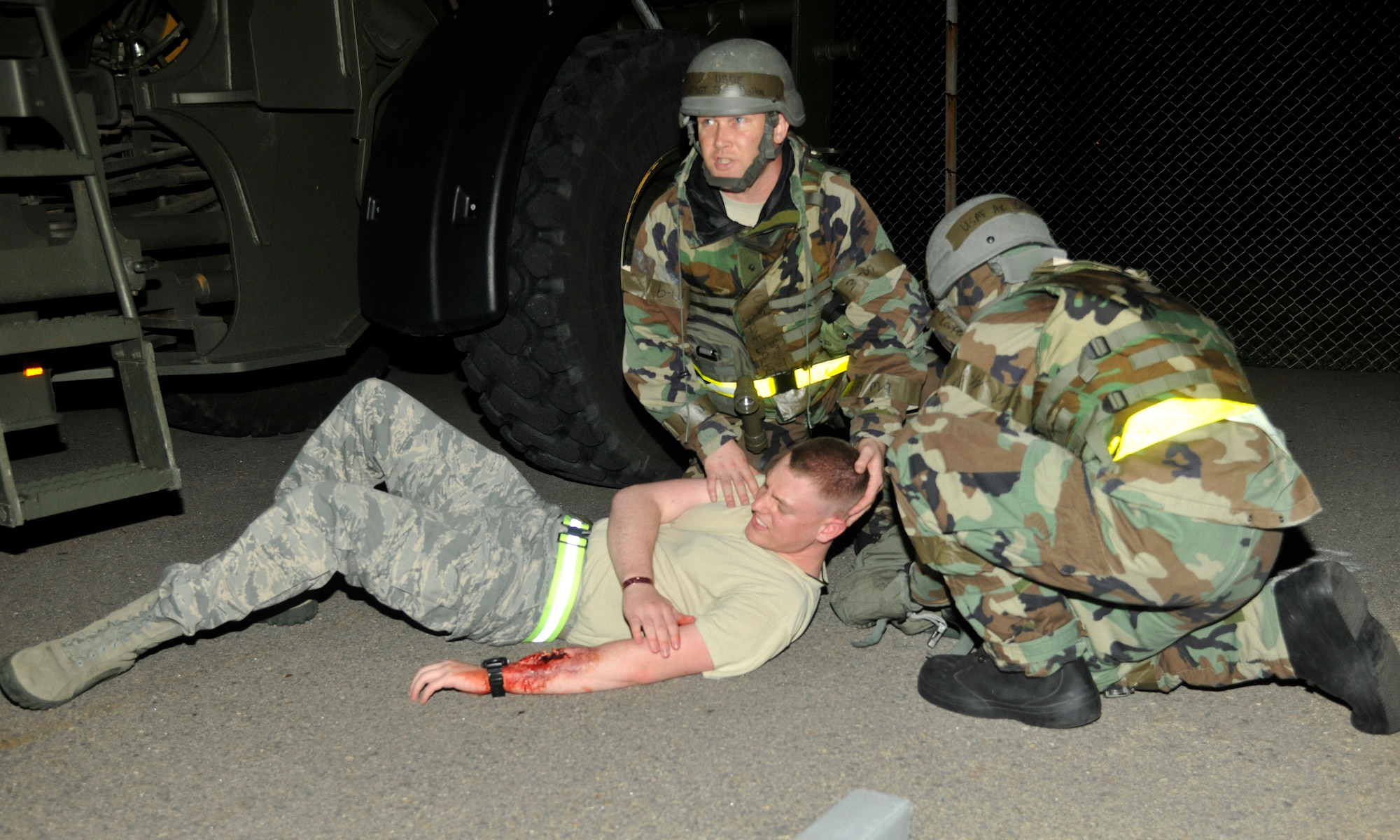 Airmen of the 8th Logistics Readiness Squadron perform self-aid buddy care at Kunsan Air Base, Republic of Korea, July 11, 2012. Kunsan Airmen practice operational readiness exercises to maintain proficiency for wartime conditions. (U.S. Air Force photo/Senior Airman Marcus Morris)