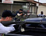 Opposing-forces role players fire from behind cover during a simulated attack for exercise Beverly Midnight 12-03 on Kunsan Air Base, Republic of Korea, July 11, 2012. The scenario tested the base’s ability to respond effectively to a ground attack from hostile forces. (U.S. Air Force photo/Staff Sgt. Jonathan Fowler)