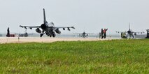 F-16 Fighting Falcons taxi into position for takeoff during exercise Beverly Midnight 12-03 on Kunsan Air Base, Republic of Korea, July 11, 2012. The exercise is designed to test the base’s operational readiness for its wartime mission. (U.S. Air Force photo/Staff Sgt. Jonathan Fowler)