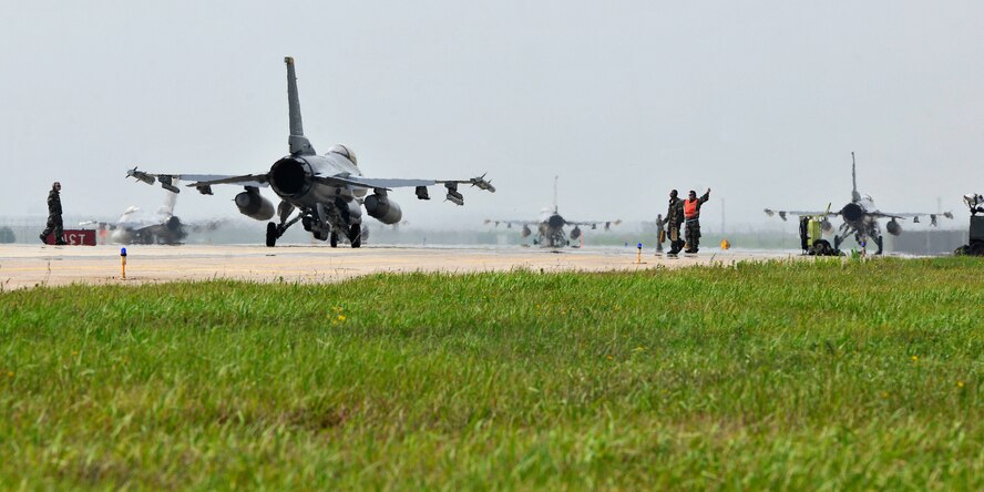 F-16 Fighting Falcons taxi into position for takeoff during exercise Beverly Midnight 12-03 on Kunsan Air Base, Republic of Korea, July 11, 2012. The exercise is designed to test the base’s operational readiness for its wartime mission. (U.S. Air Force photo/Staff Sgt. Jonathan Fowler)