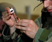 Senior Airman Jeffrey Gomez, 8th  Medical Operations Squadron, tests water samples after a simulated chemical attack during exercise Beverly Midnight 12-03 on Kunsan Air Base, Republic of Korea, July 11, 2012. Water samples are taken and tested from various locations on base, such as the water treatment center, to ensure that the water has not been contaminated during a chemical attack. (U.S. Air Force photo/Staff Sgt. Jonathan Fowler)